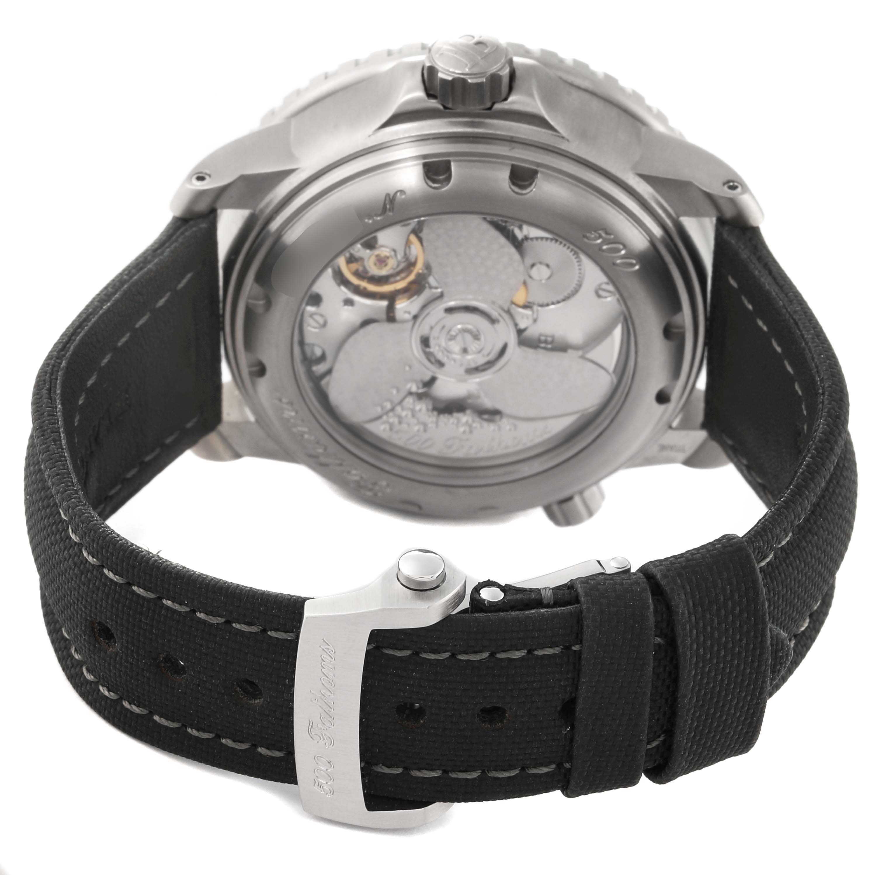 The image shows the backside view of a Blancpain Fifty Fathoms 50021-12B30-52B Men's Titanium Black Dial 50021-12B30-52B Men's Titanium Black Dial watch, highlighting its movement and strap buckle.