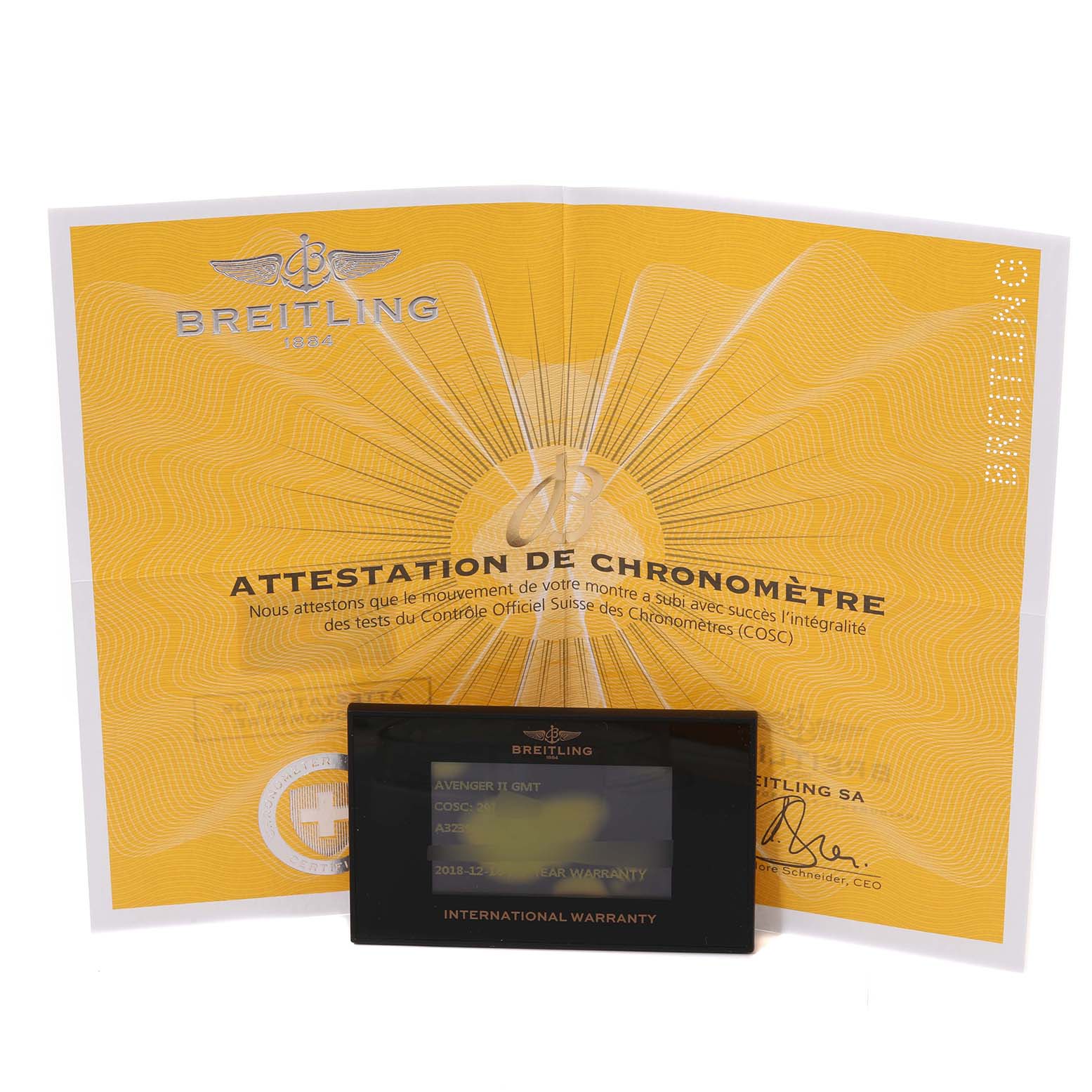 The image shows a warranty card and a chronometer certificate for the Breitling Avenger A32390 Men's Stainless Steel Mother of Pearl Dial A32390 Men's Stainless Steel Mother of Pearl Dial model.