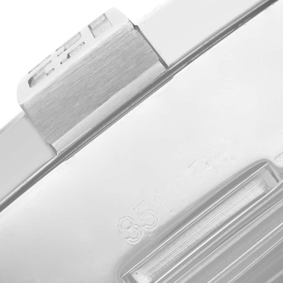 The image shows a close-up of the side of a Breitling Avenger A32390 Men's Stainless Steel Mother of Pearl Dial A32390 Men's Stainless Steel Mother of Pearl Dial watch case, highlighting the brushed finish and partial engraving.