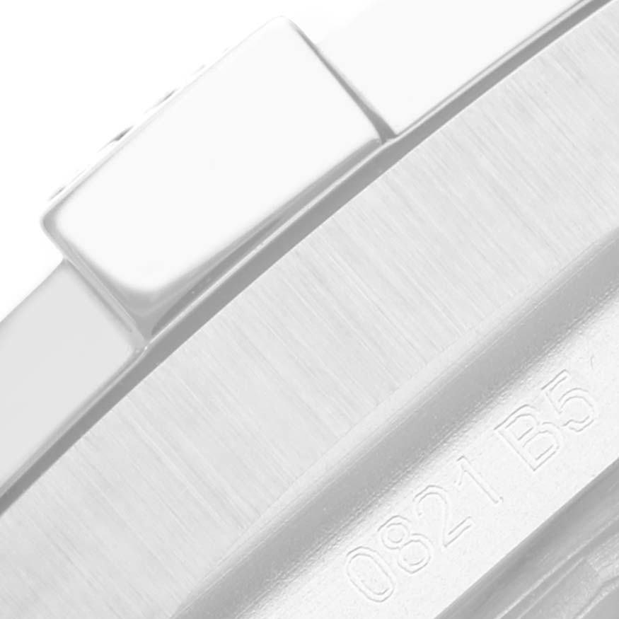 This close-up image of a Breitling Avenger A17318101B1A1 Men's Stainless Steel Black Dial A17318101B1A1 Men's Stainless Steel Black Dial watch showcases part of the case and a button.