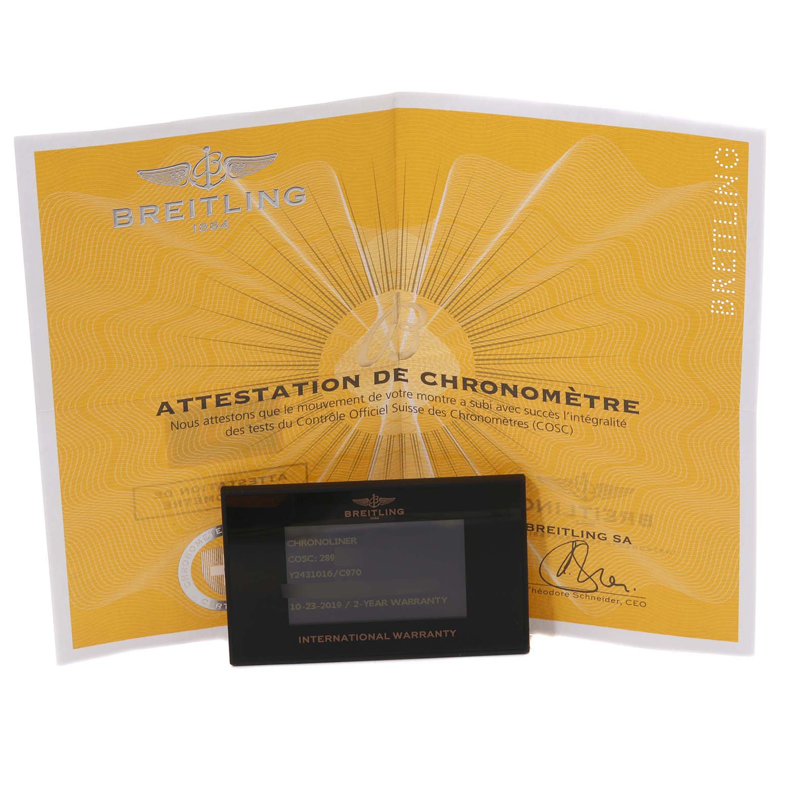 The image shows a Breitling Chronoliner Y243106/C970 Men's Stainless Steel Blue Dial Y243106/C970 Men's Stainless Steel Blue Dial warranty card and a certificate of chronometer, angled slightly from above.