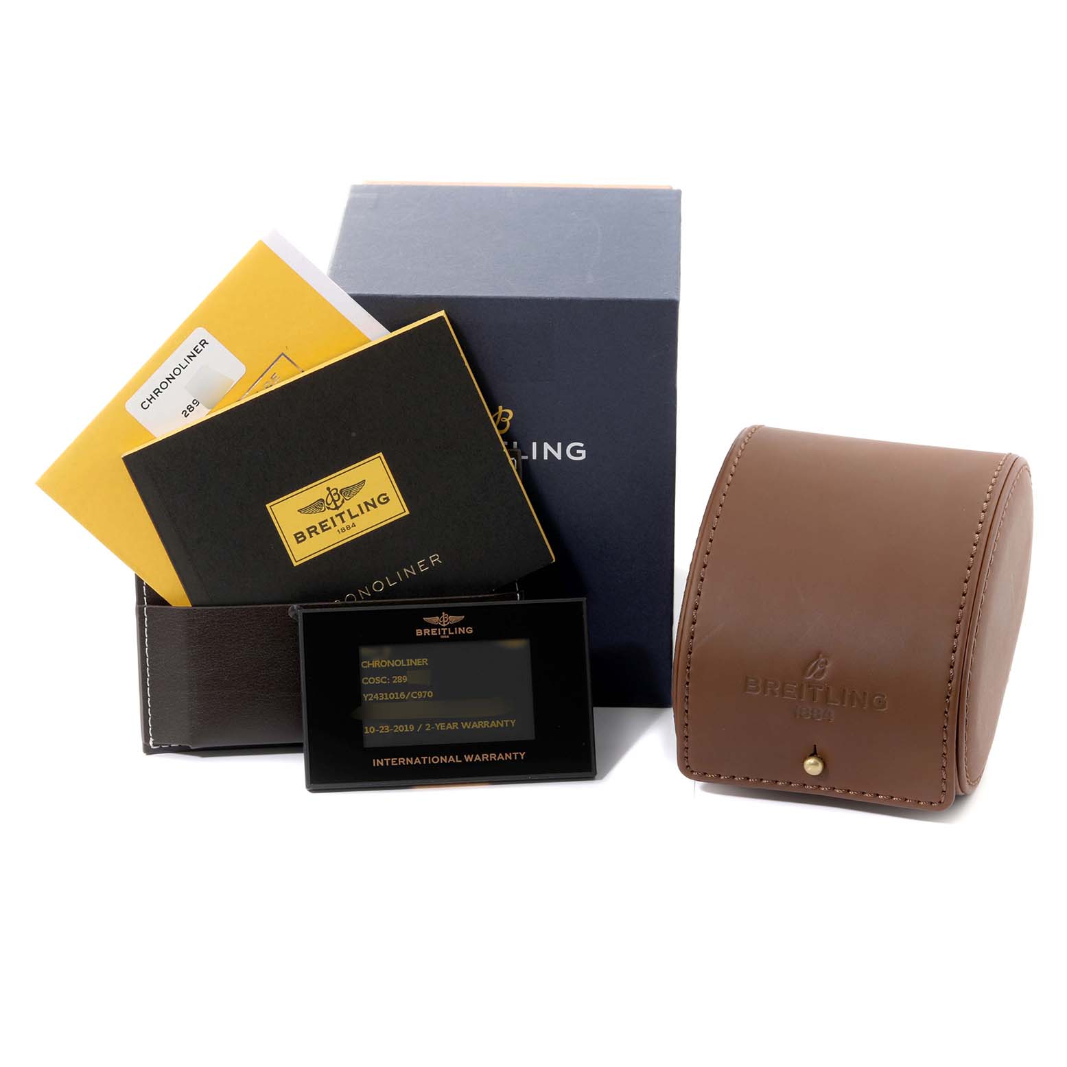 The image shows packaging, warranty cards, manuals, and a leather case for a Breitling Chronoliner Y243106/C970 Men's Stainless Steel Blue Dial Y243106/C970 Men's Stainless Steel Blue Dial watch.