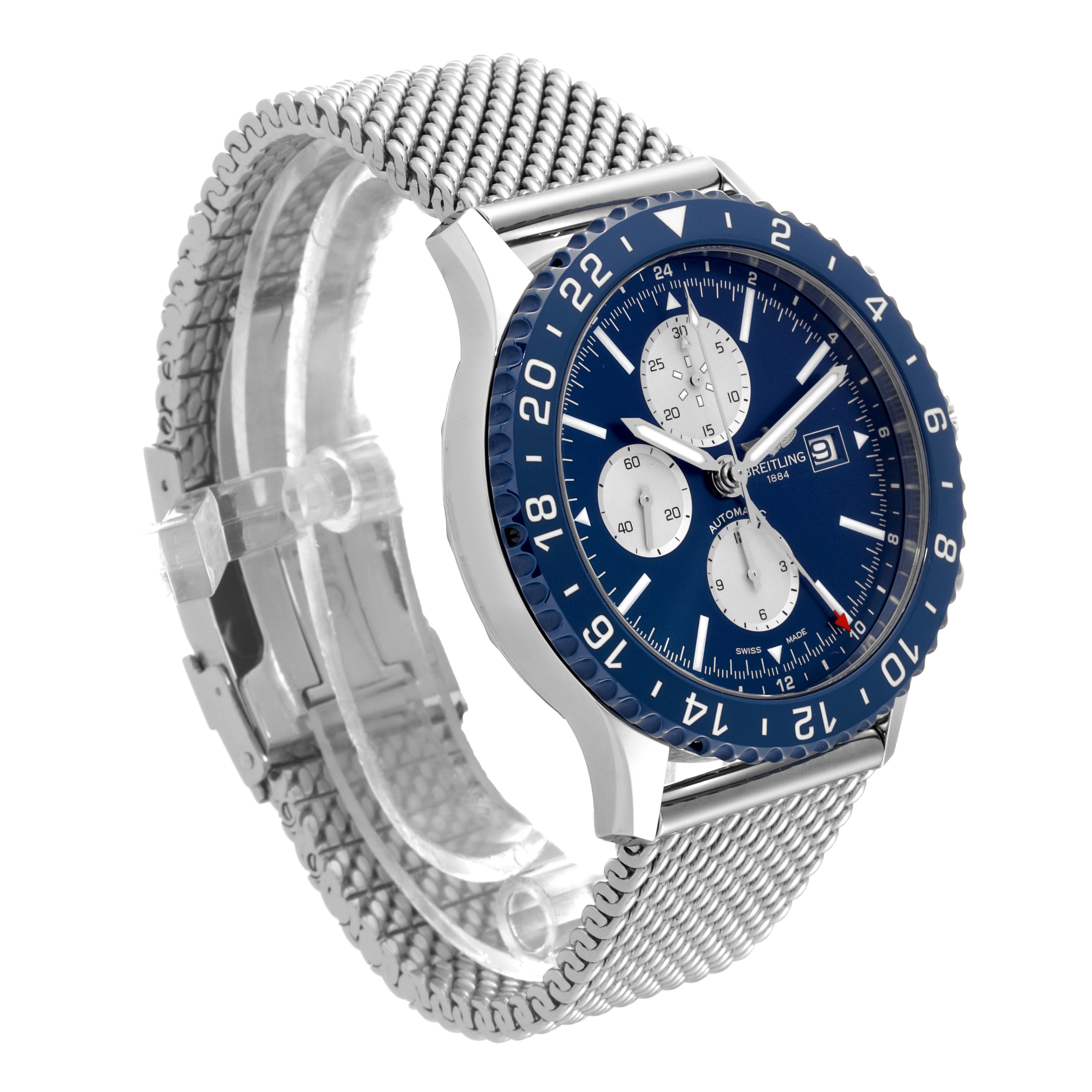 The Breitling Chronoliner Y243106/C970 Men's Stainless Steel Blue Dial Y243106/C970 Men's Stainless Steel Blue Dial watch is shown at an angle highlighting the blue dial, bezel, chronograph subdials, date window, and mesh bracelet.