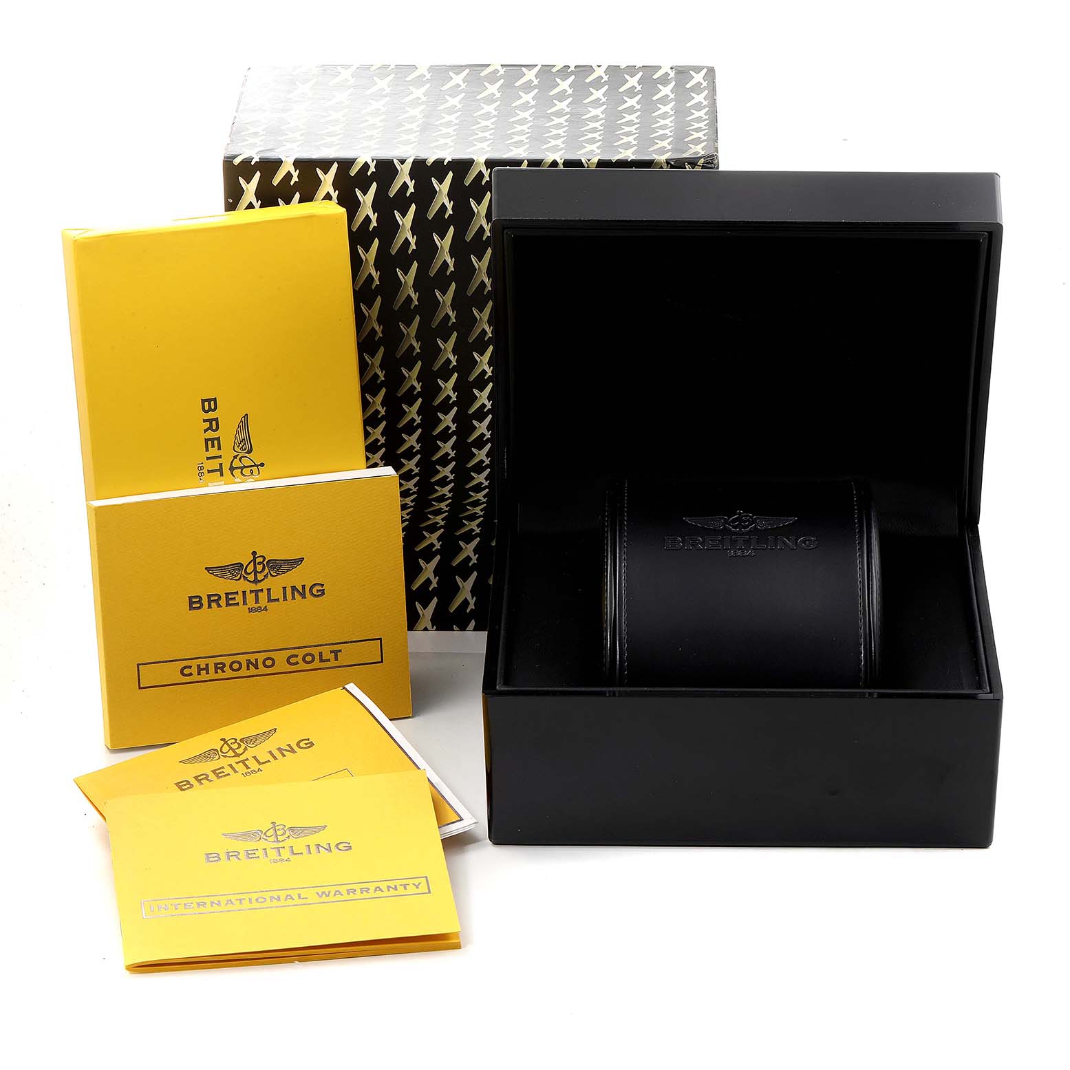 This image shows the packaging and accessories for a Breitling Colt A73380 Men
s Stainless Steel White Dial A73380 Men
s Stainless Steel White Dial watch, including the box, manual, and warranty card.
