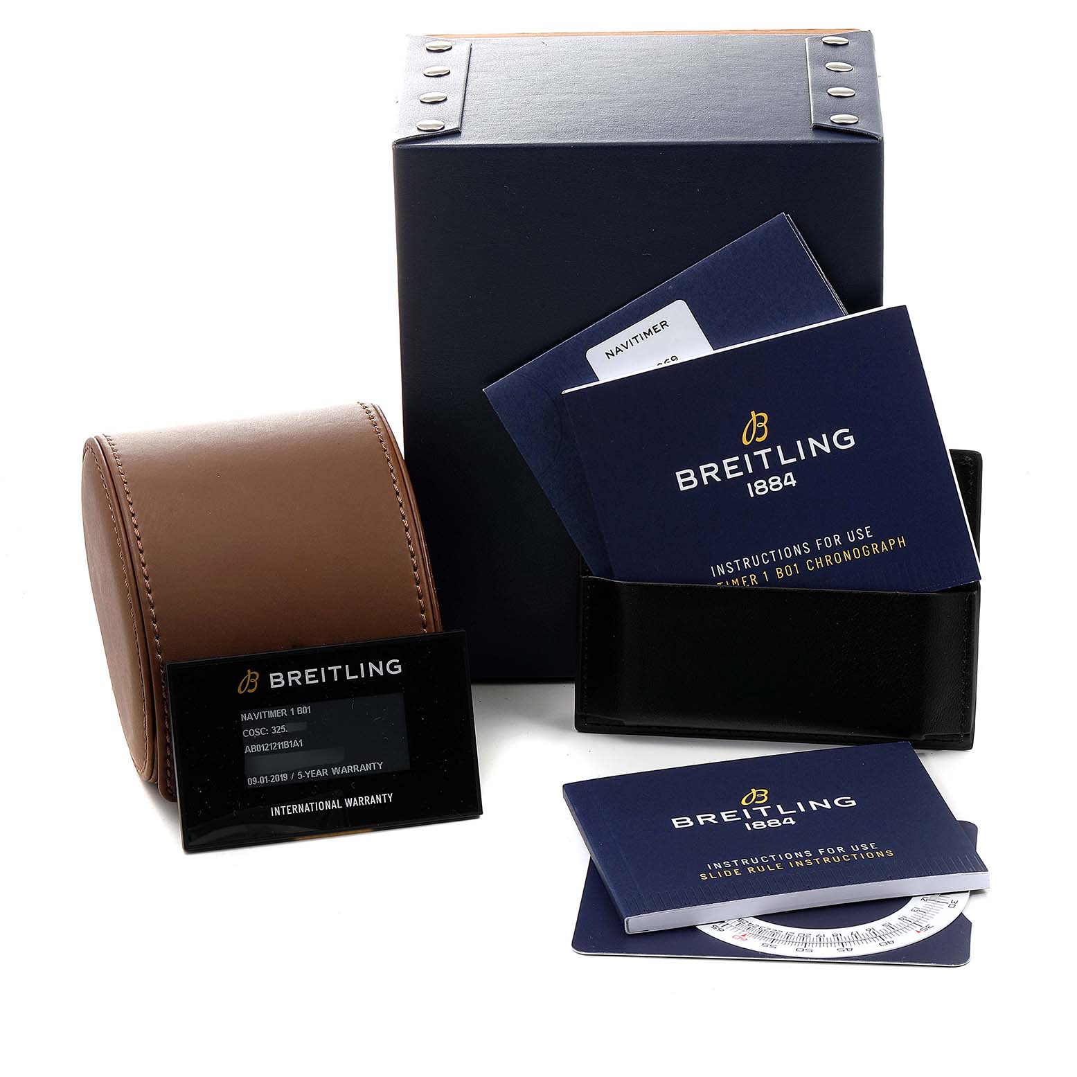 The image shows a Breitling Navitimer AB0121 Men
s Stainless Steel Black Dial AB0121 Men
s Stainless Steel Black Dial watch box, leather case, warranty card, and instruction booklets.