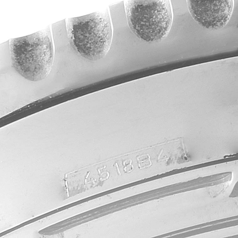 This image shows a close-up of the case back with engraved serial number of the Breitling Navitimer AB0121 Men
s Stainless Steel Black Dial AB0121 Men
s Stainless Steel Black Dial watch.