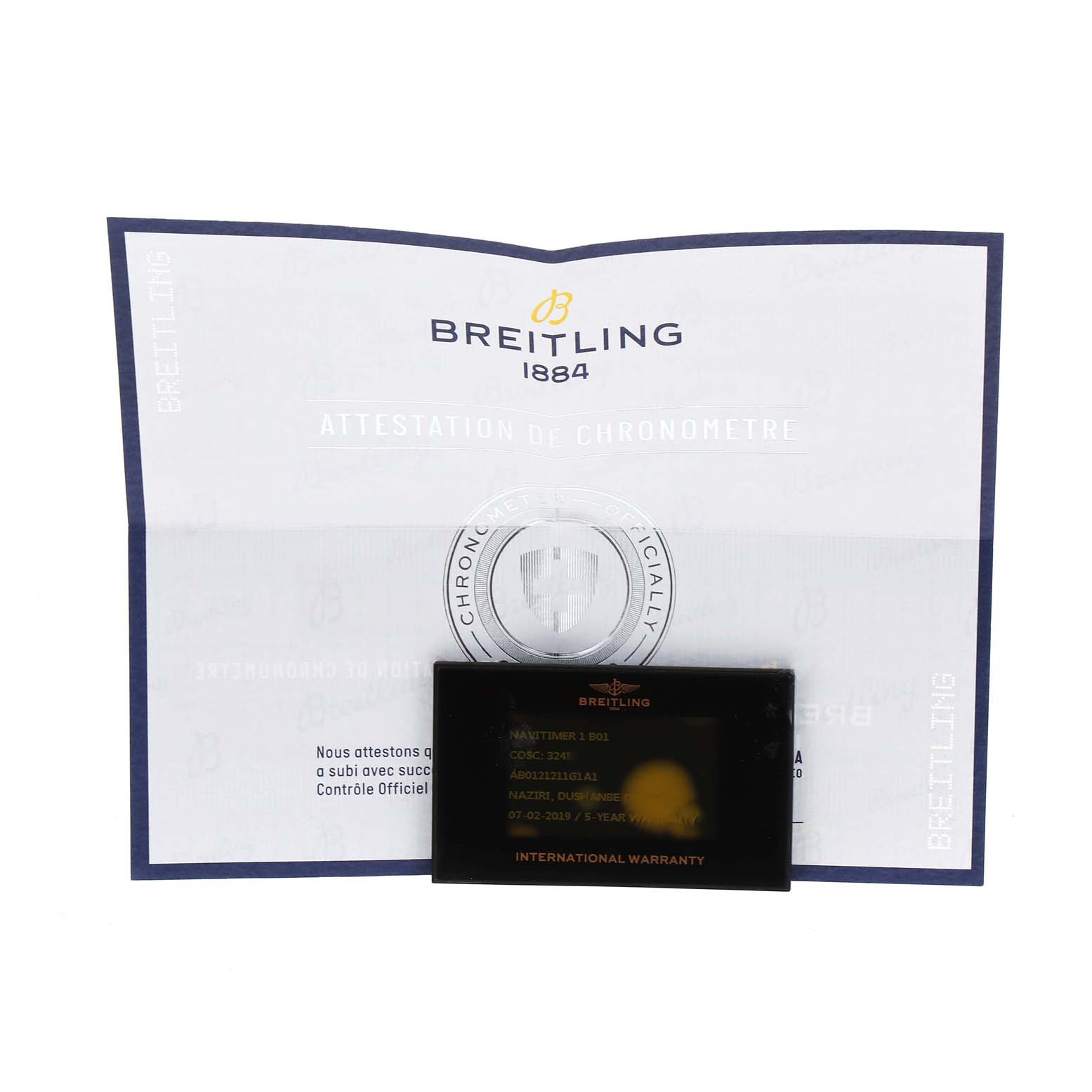 The image shows warranty documentation and certification papers for a Breitling Navitimer AB0121 Men's Stainless Steel Silver Dial AB0121 Men's Stainless Steel Silver Dial model watch.