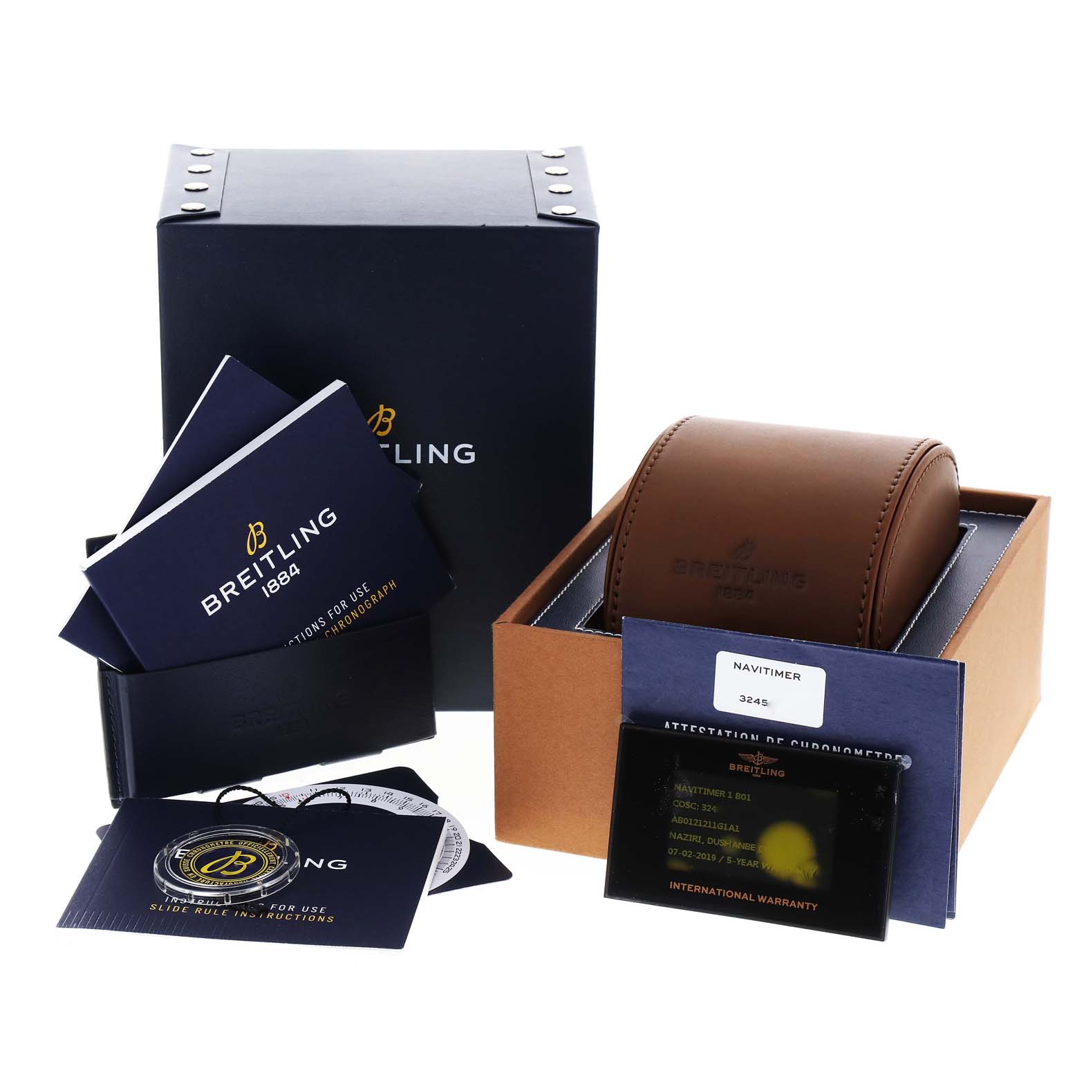 The image shows the Breitling Navitimer AB0121 Men's Stainless Steel Silver Dial AB0121 Men's Stainless Steel Silver Dial's leather box, warranty card, user manuals, and a branded outer box, all displayed from an angle.