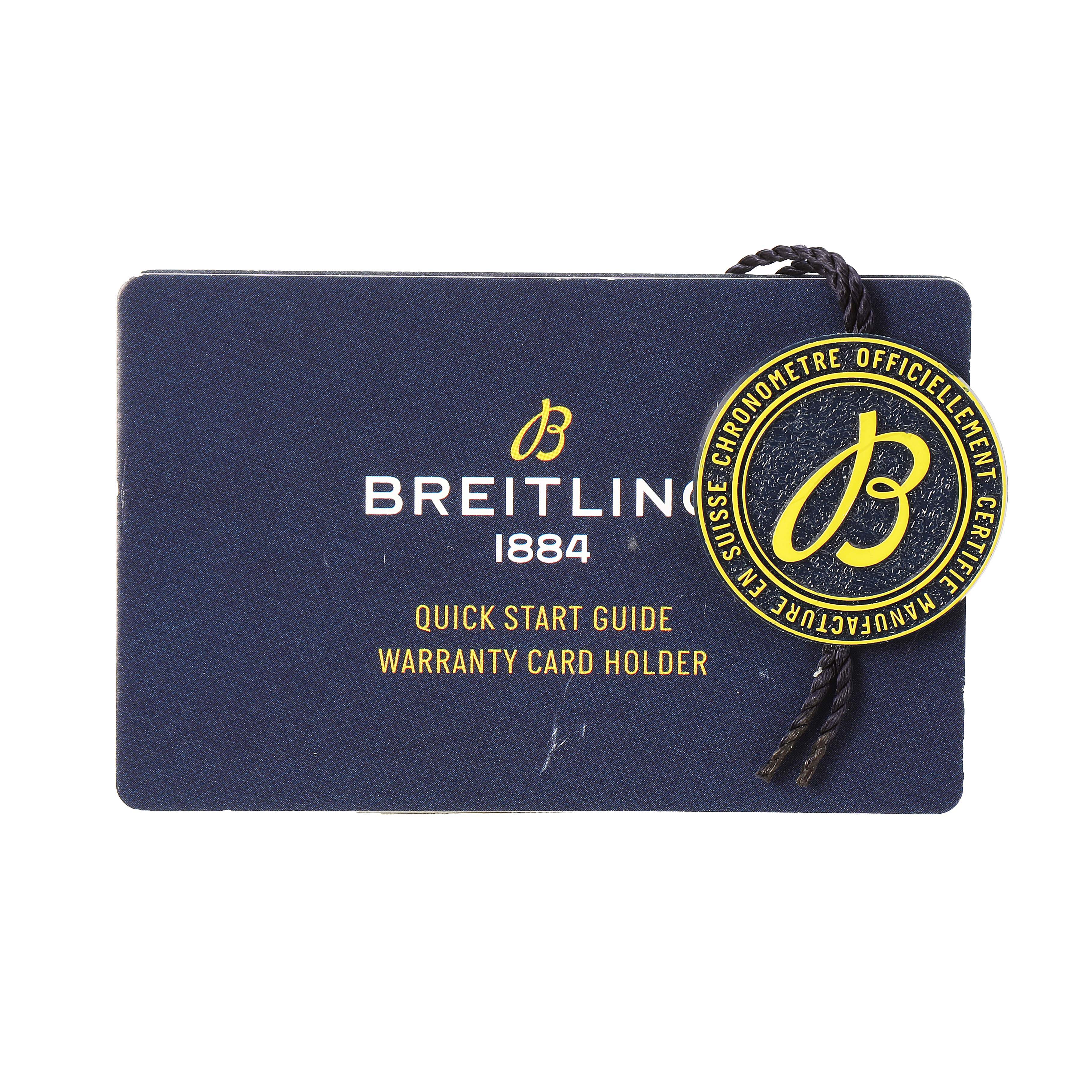The image shows a Breitling Navitimer AB0121 Men's Stainless Steel Black Dial branded warranty card holder and quick start guide, with a Breitling medallion attached.