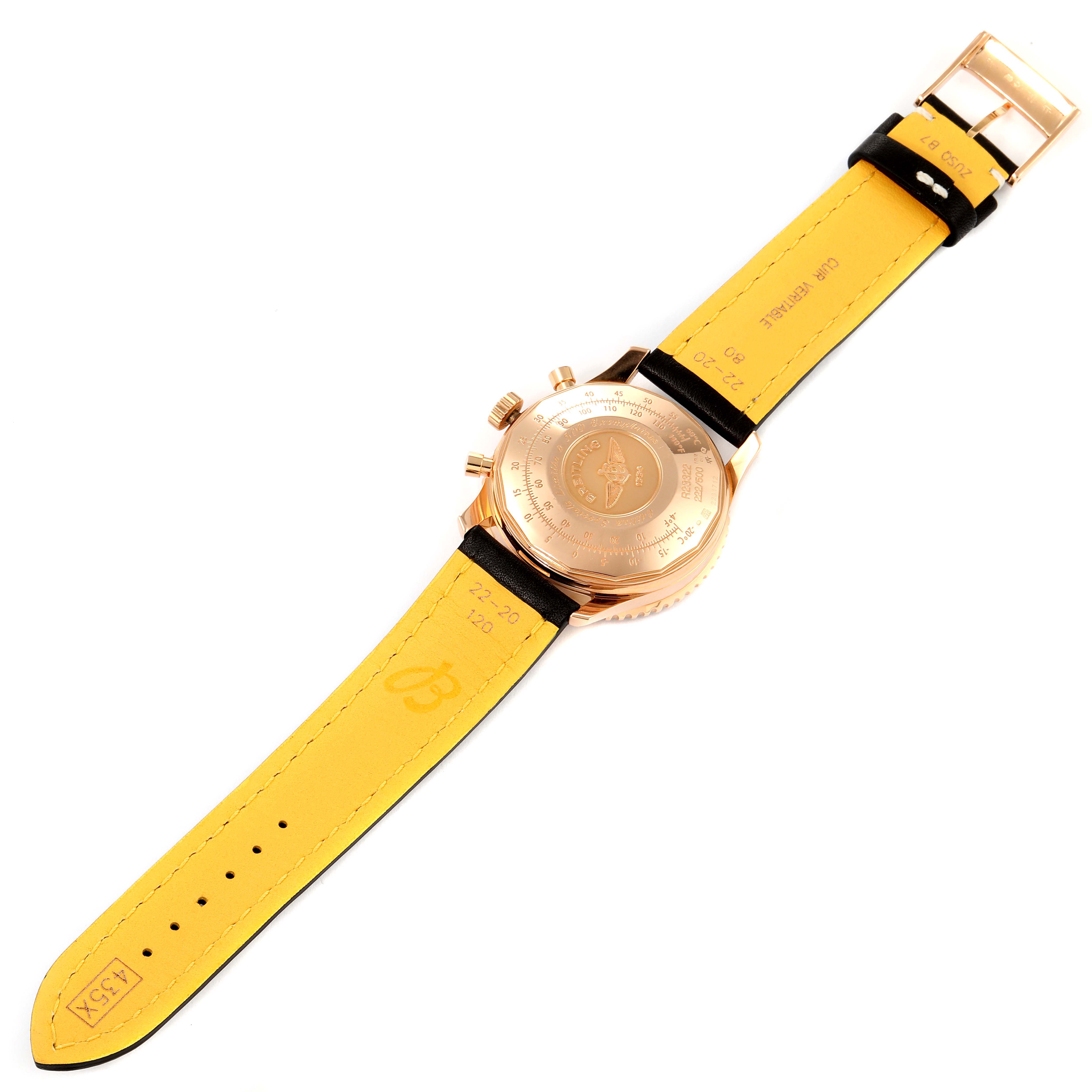 The image shows the back and strap of a Breitling Navitimer R23322 Men's Rose Gold Black Dial R23322 Men's Rose Gold Black Dial watch, displaying its case back and yellow leather strap.