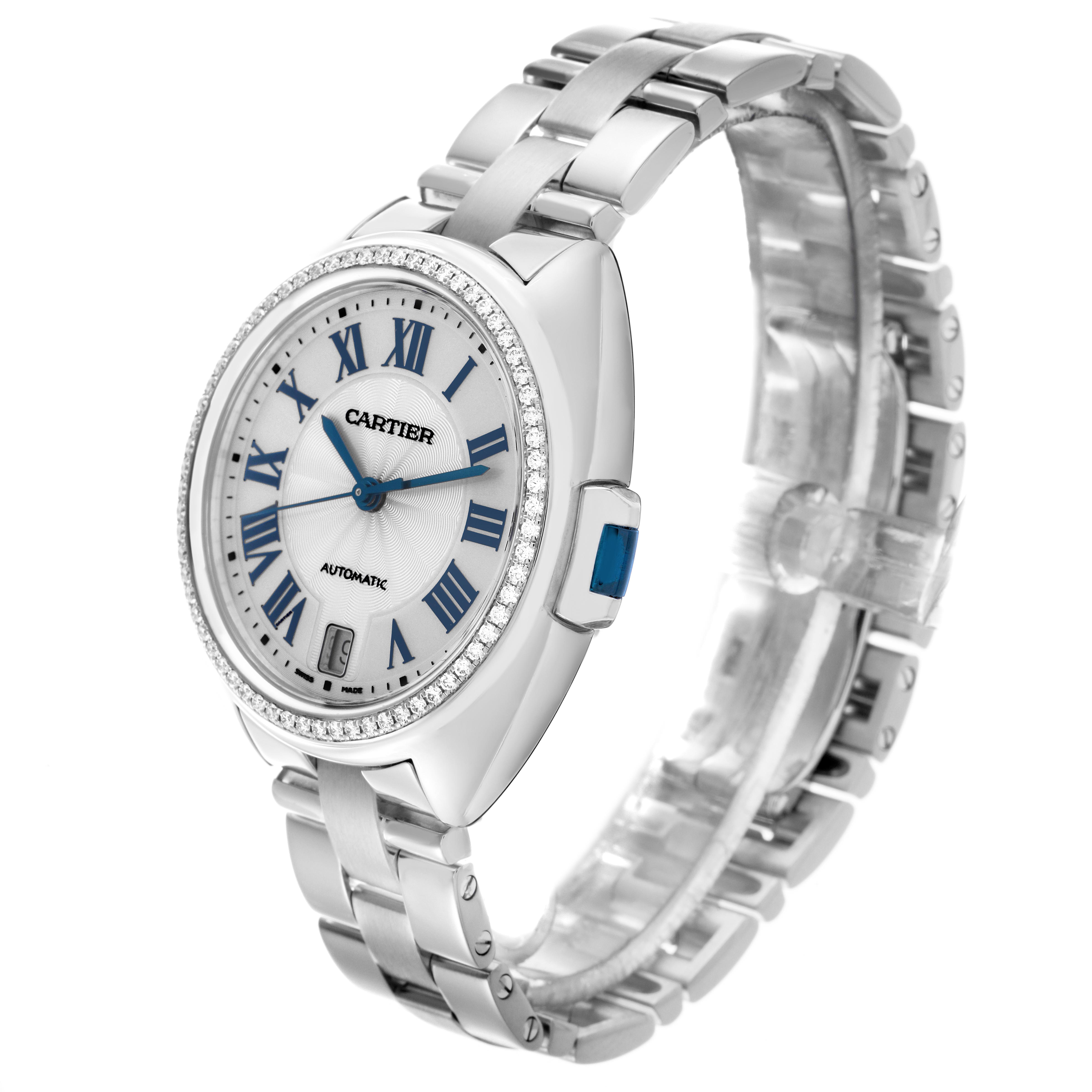 The Cartier Clé watch is shown at a three-quarter angle, highlighting its face, bezel, bracelet, and crown.