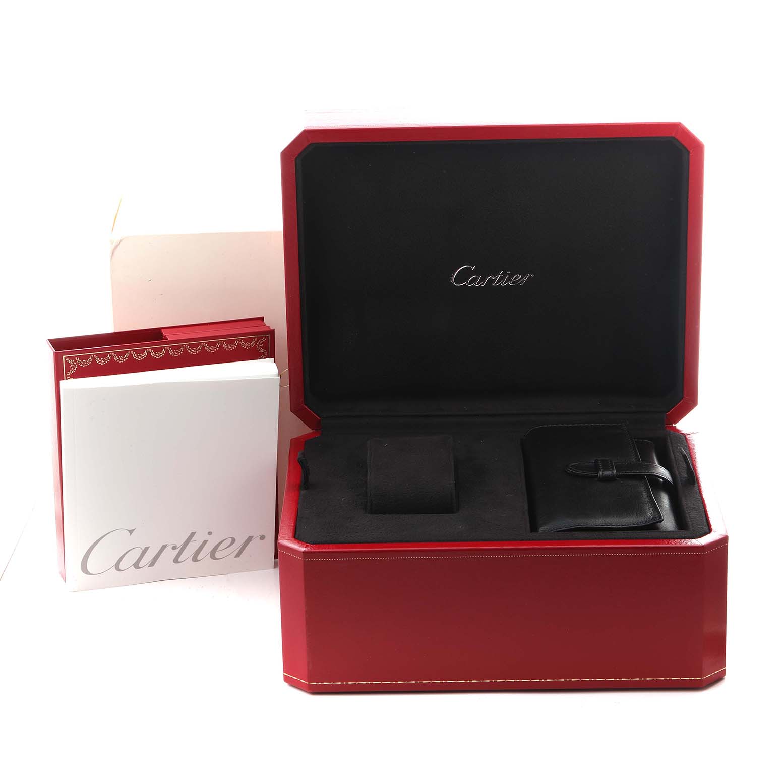 The image shows a Cartier Roadster W62020X6 Men
s Stainless Steel Black Dial W62020X6 Men
s Stainless Steel Black Dial watch box set, including a red box, storage pouch, and booklet, with the lid open.