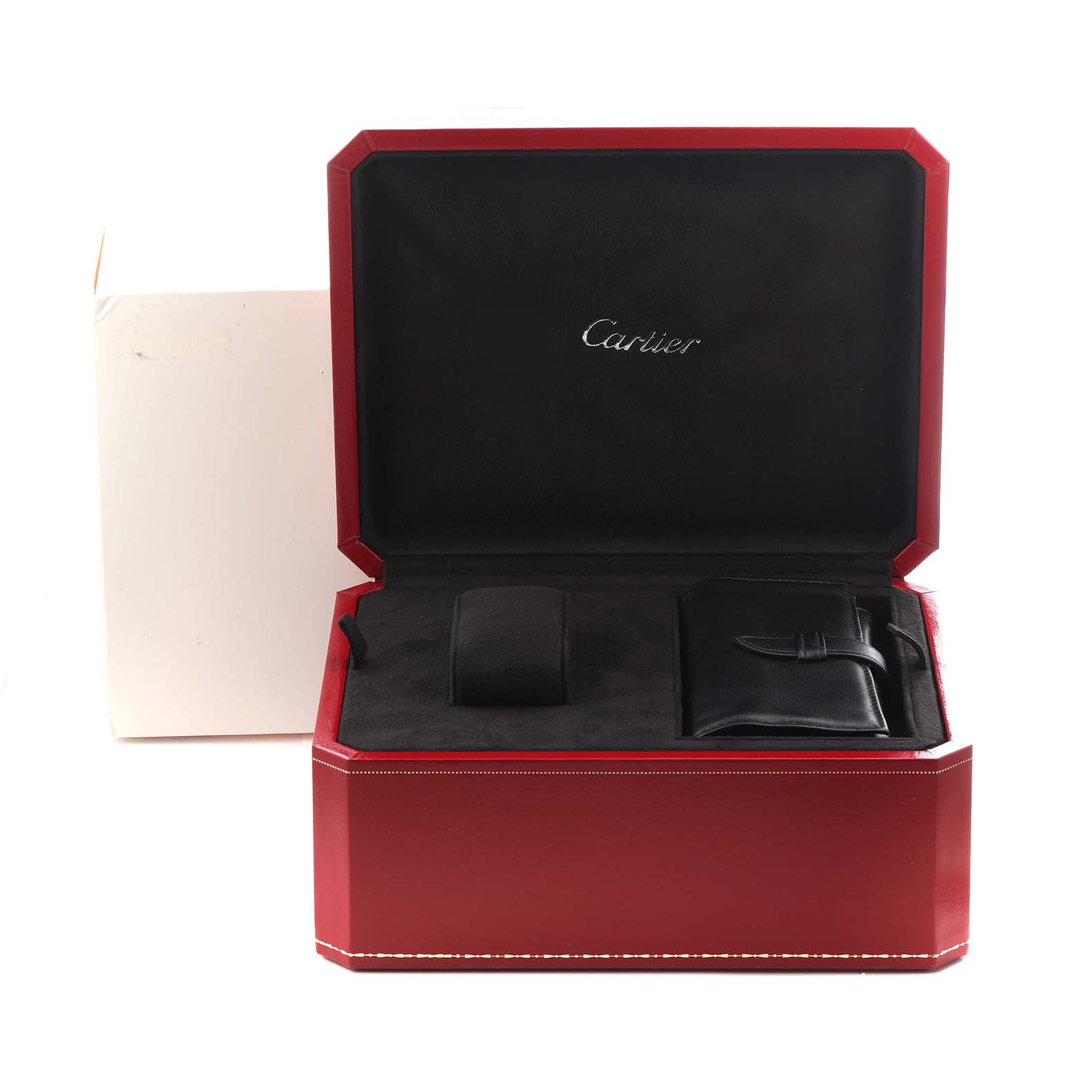 The image shows a Cartier Roadster W62020X6 Men
s Stainless Steel Black Dial W62020X6 Men
s Stainless Steel Black Dial watch box open, displaying a watch cushion and a leather holder inside.