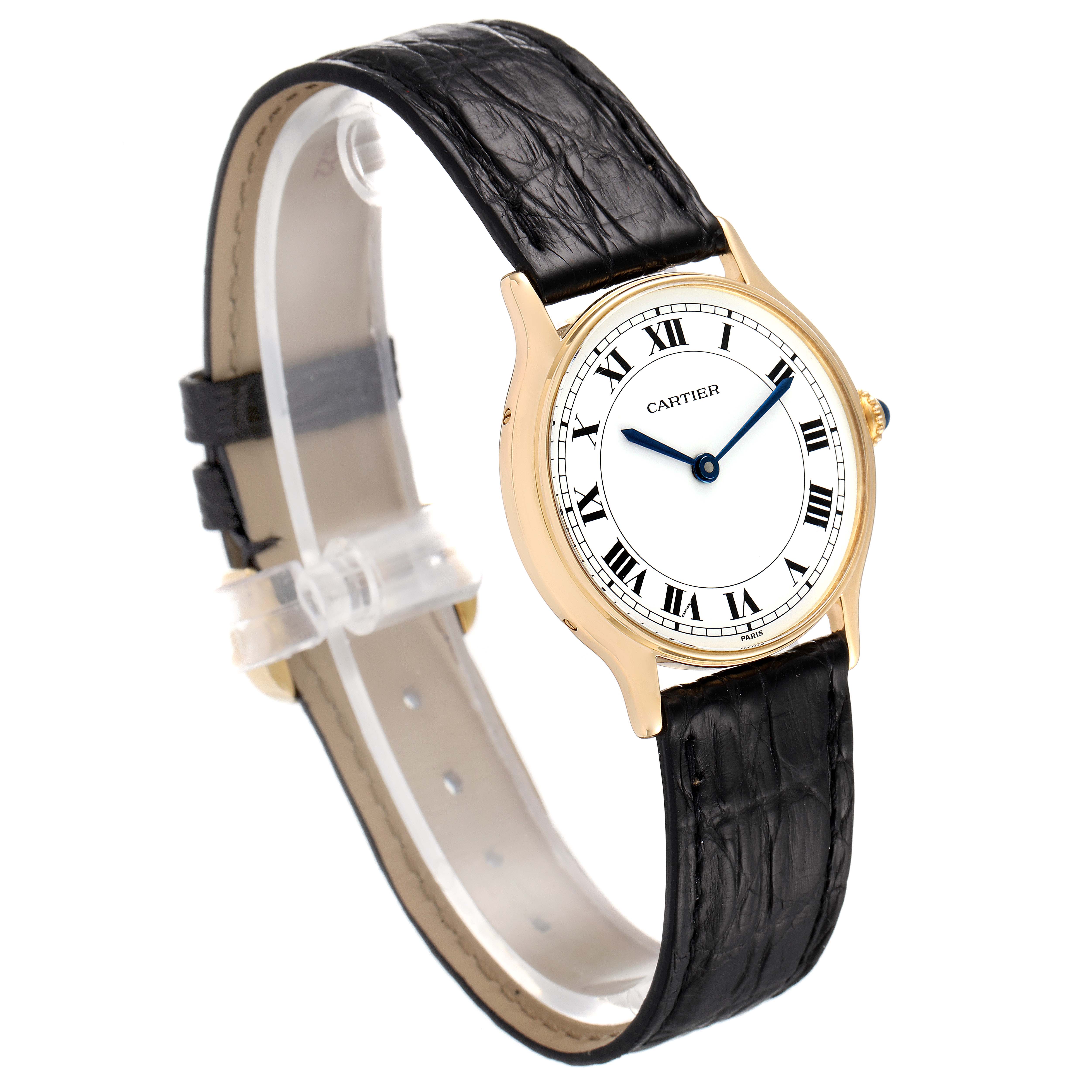 The image shows a side angle view of a Cartier Ronde  Women's Yellow Gold Silver Dial  Women's Yellow Gold Silver Dial model watch, highlighting the dial, case, and black leather strap.