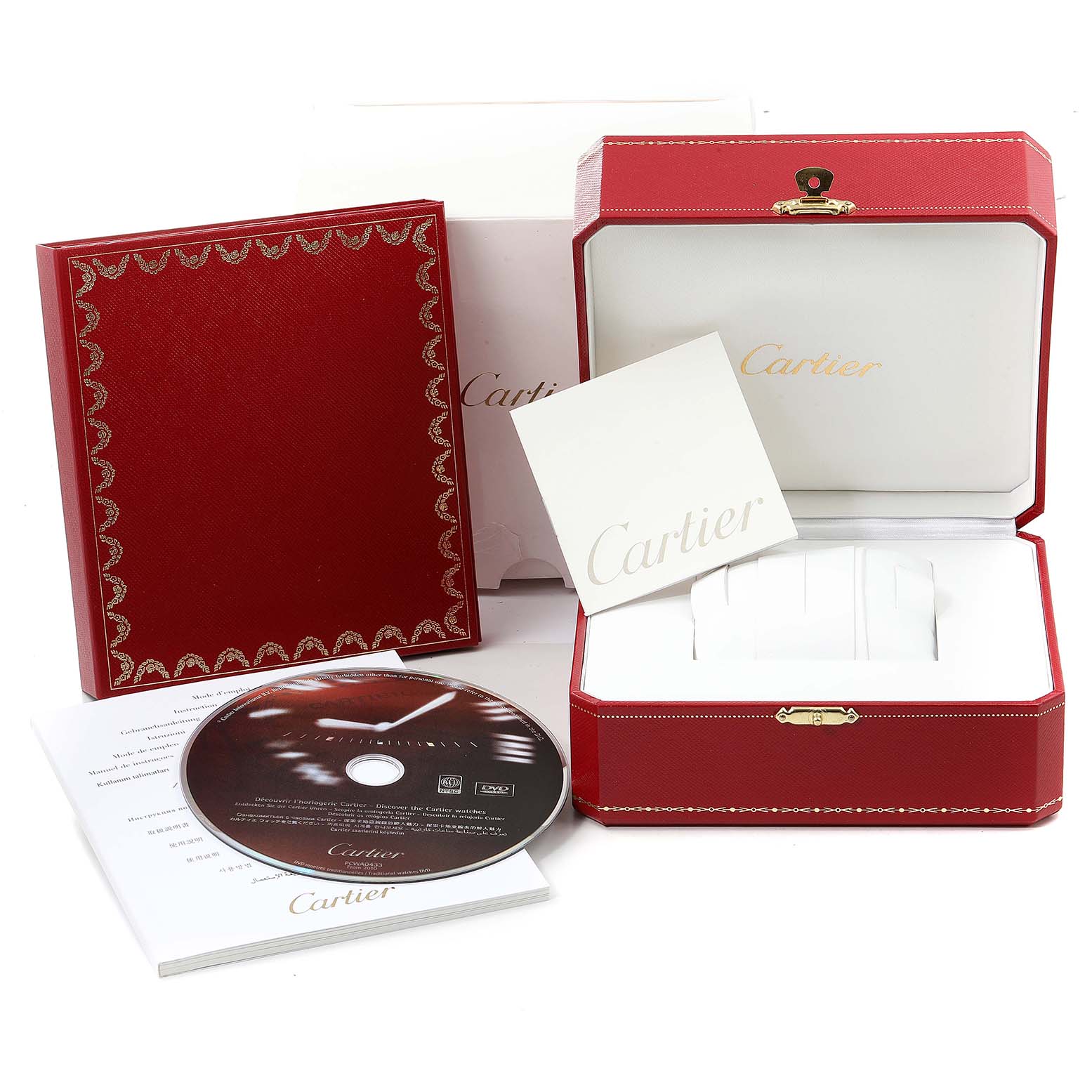 The image shows the packaging and accessories for a Cartier Ronde  Women's Yellow Gold Silver Dial  Women's Yellow Gold Silver Dial watch, including a red box, booklet, CD, and document envelope.