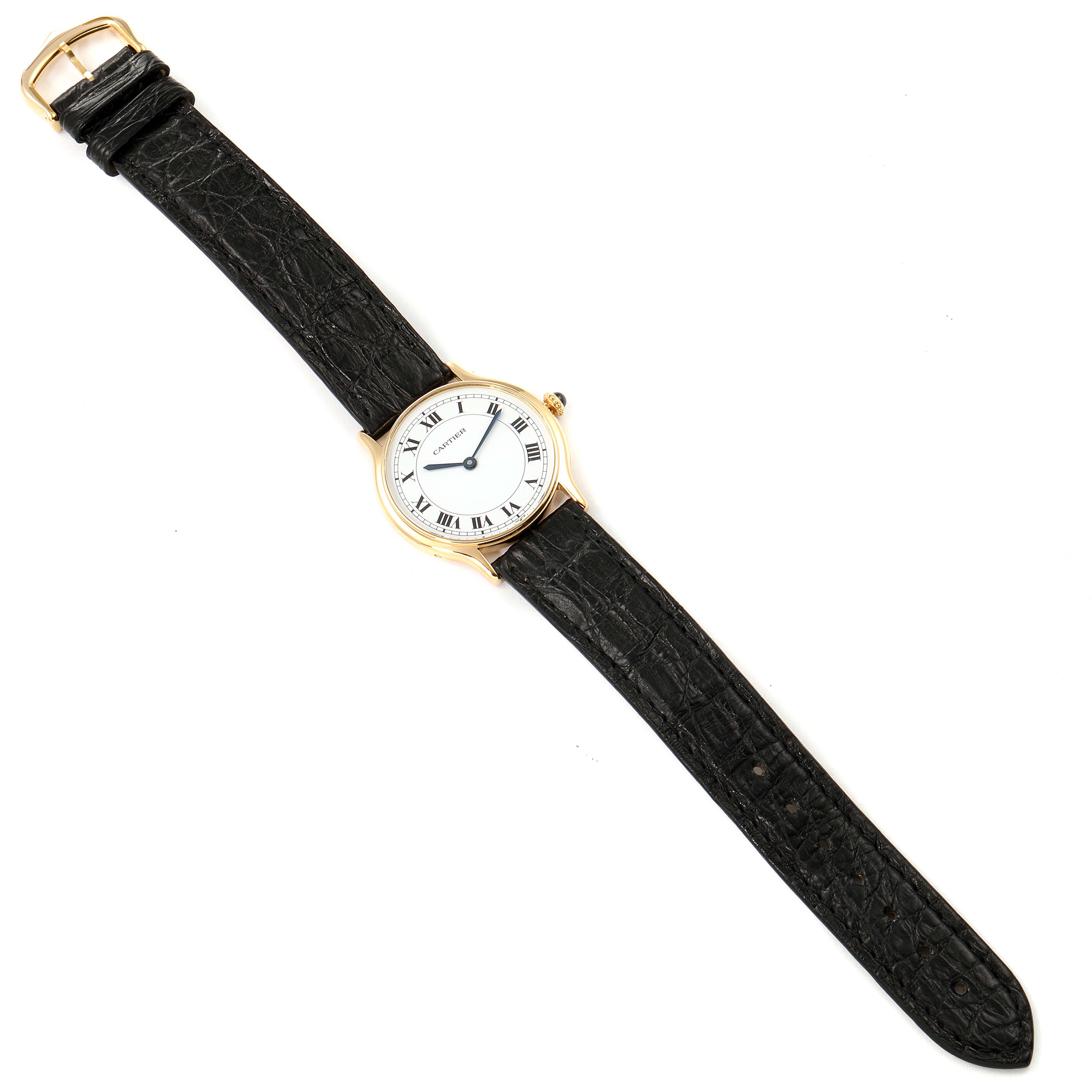 This image shows the entire Cartier Ronde  Women's Yellow Gold Silver Dial  Women's Yellow Gold Silver Dial watch, displaying its face, case, and black leather strap flat on a white background.