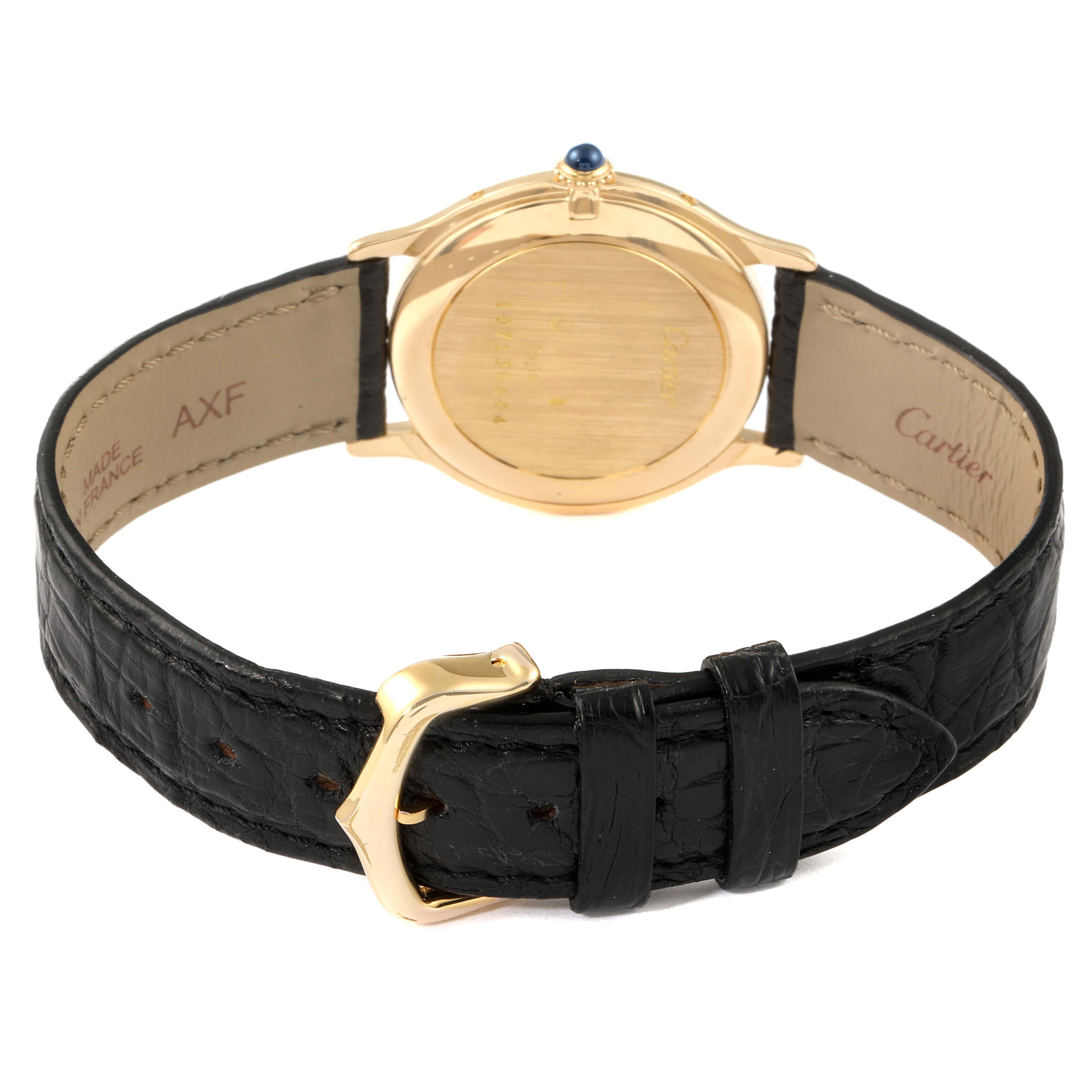 The image shows the back of a Cartier Ronde  Women's Yellow Gold Silver Dial  Women's Yellow Gold Silver Dial watch, highlighting the leather strap and buckle.