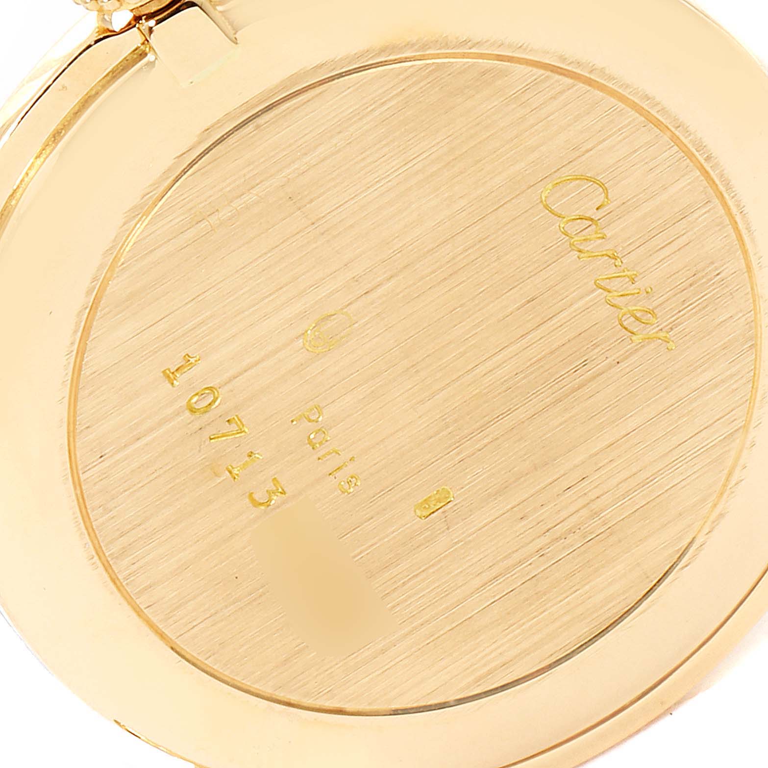 The image shows the engraved backside of a Cartier Ronde  Women's Yellow Gold Silver Dial  Women's Yellow Gold Silver Dial watch, demonstrating its gold finish and model details.