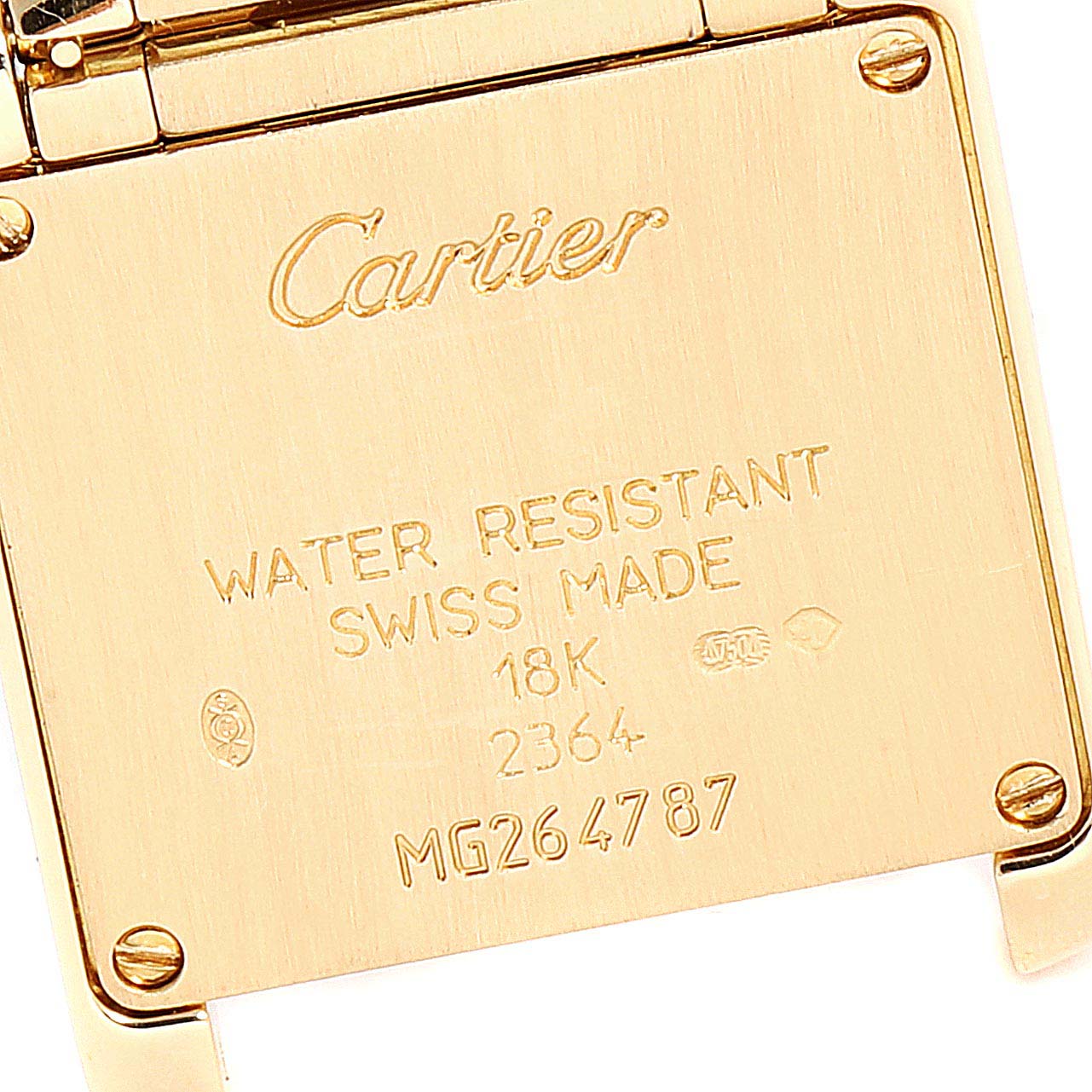This is a close-up of the back case of the Cartier Tank Française watch, showing the brand, water resistance, and serial number.