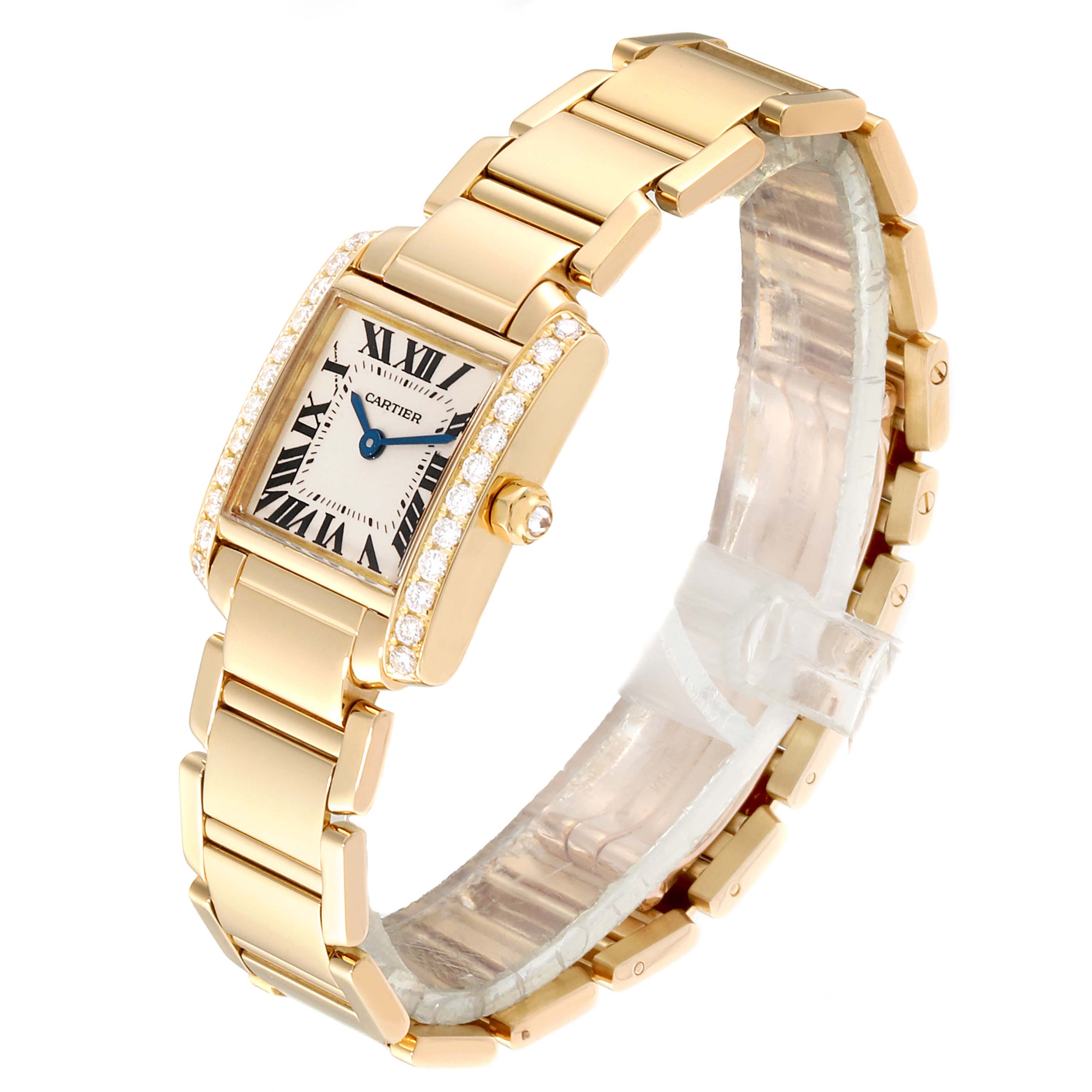 The image shows a gold Cartier Tank Francaise WE1001R8 Women's Yellow Gold Silver Dial WE1001R8 Women's Yellow Gold Silver Dial watch at a three-quarter angle, highlighting the rectangular dial, bracelet, and diamond details.