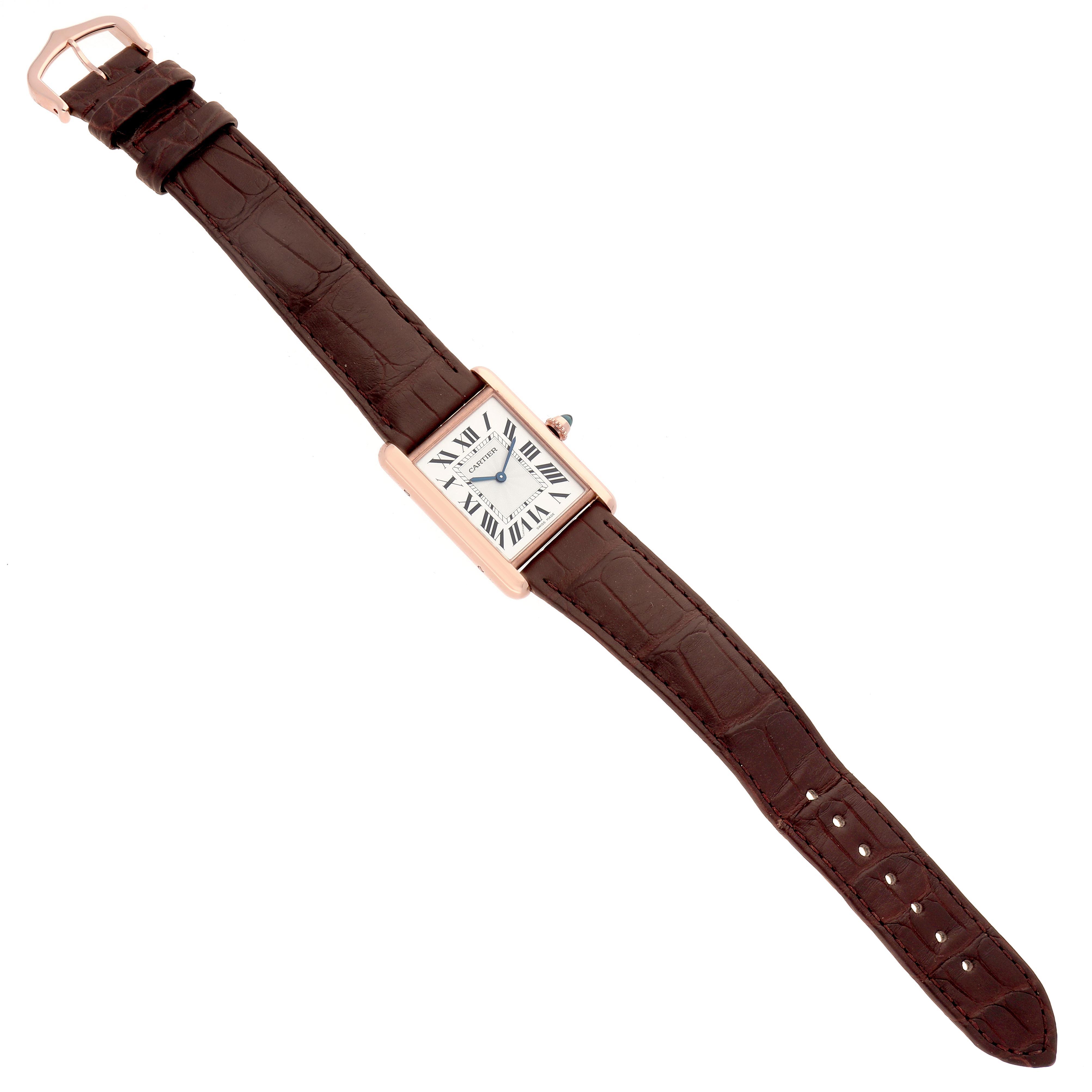 The Cartier Tank Louis WGTA0011 Men
s Rose Gold Silver Dial WGTA0011 Men
s Rose Gold Silver Dial watch is shown from a top-down angle, displaying its entire rectangular face and brown leather strap.