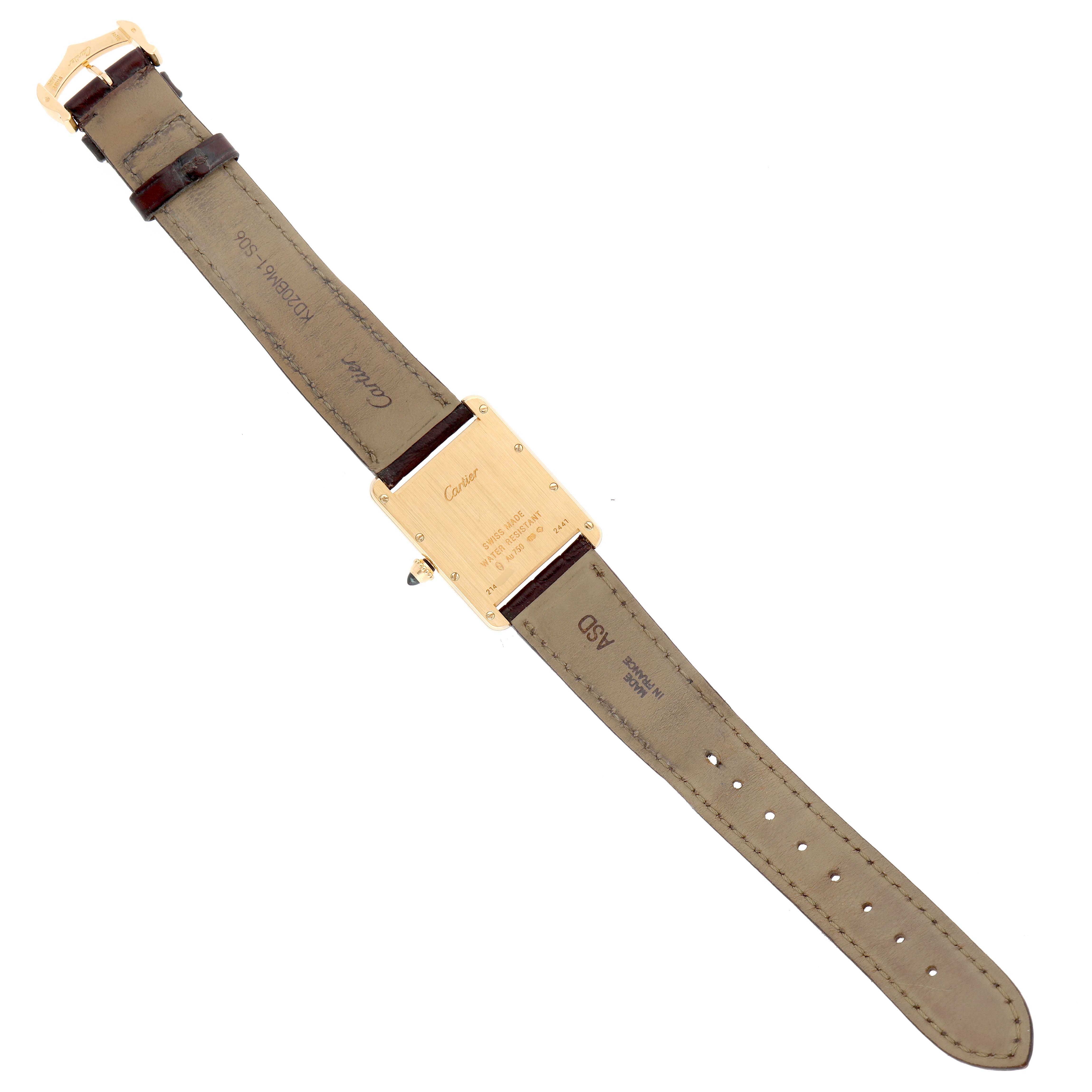 The image shows the back case and strap of a Cartier Tank Louis W1529756 Men's Yellow Gold Silver Dial watch laid flat.