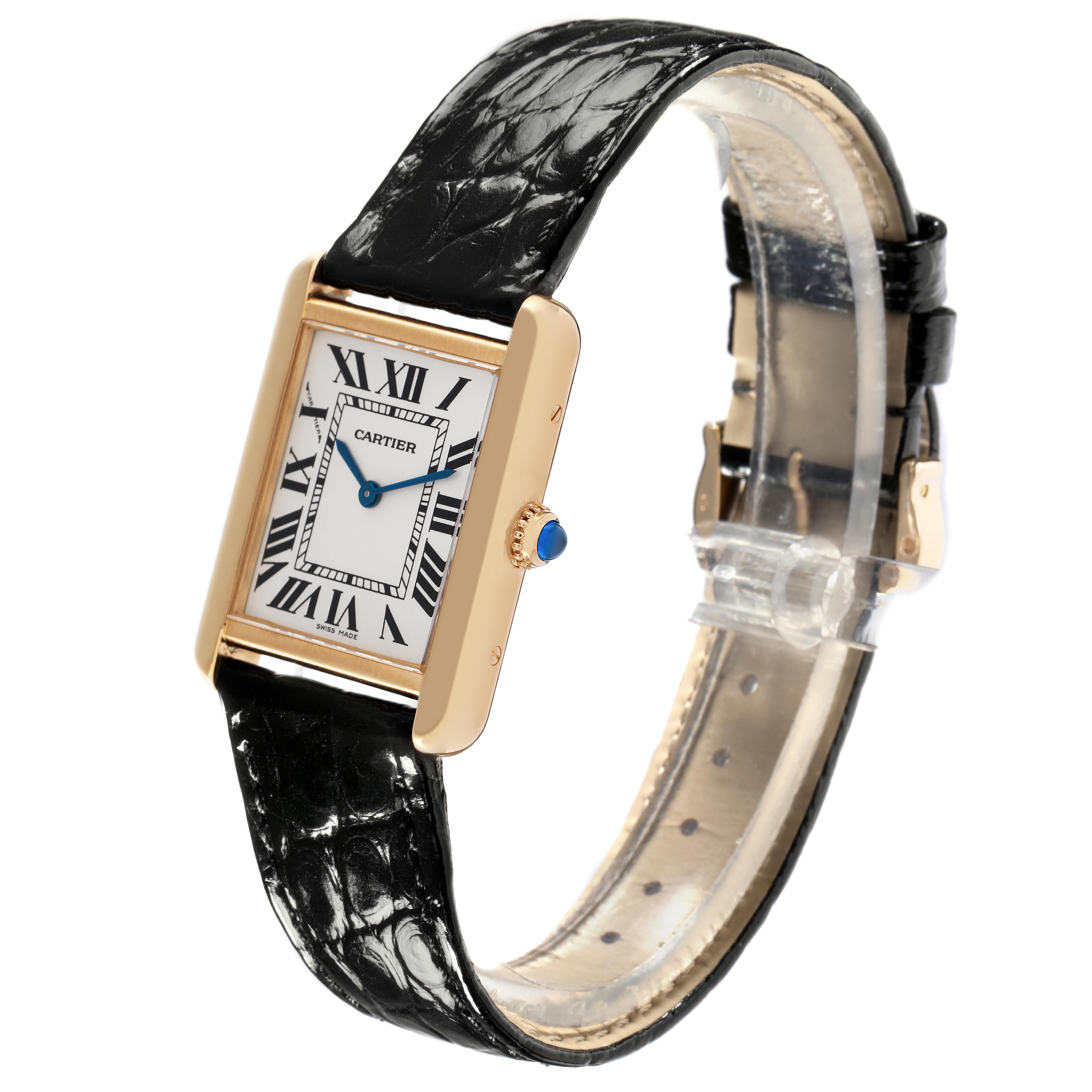 The Cartier Tank Solo W1018755 Women
s Yellow Gold Silver Dial W1018755 Women
s Yellow Gold Silver Dial watch is shown at an angled side view, highlighting its rectangular face, Roman numerals, and black leather strap.