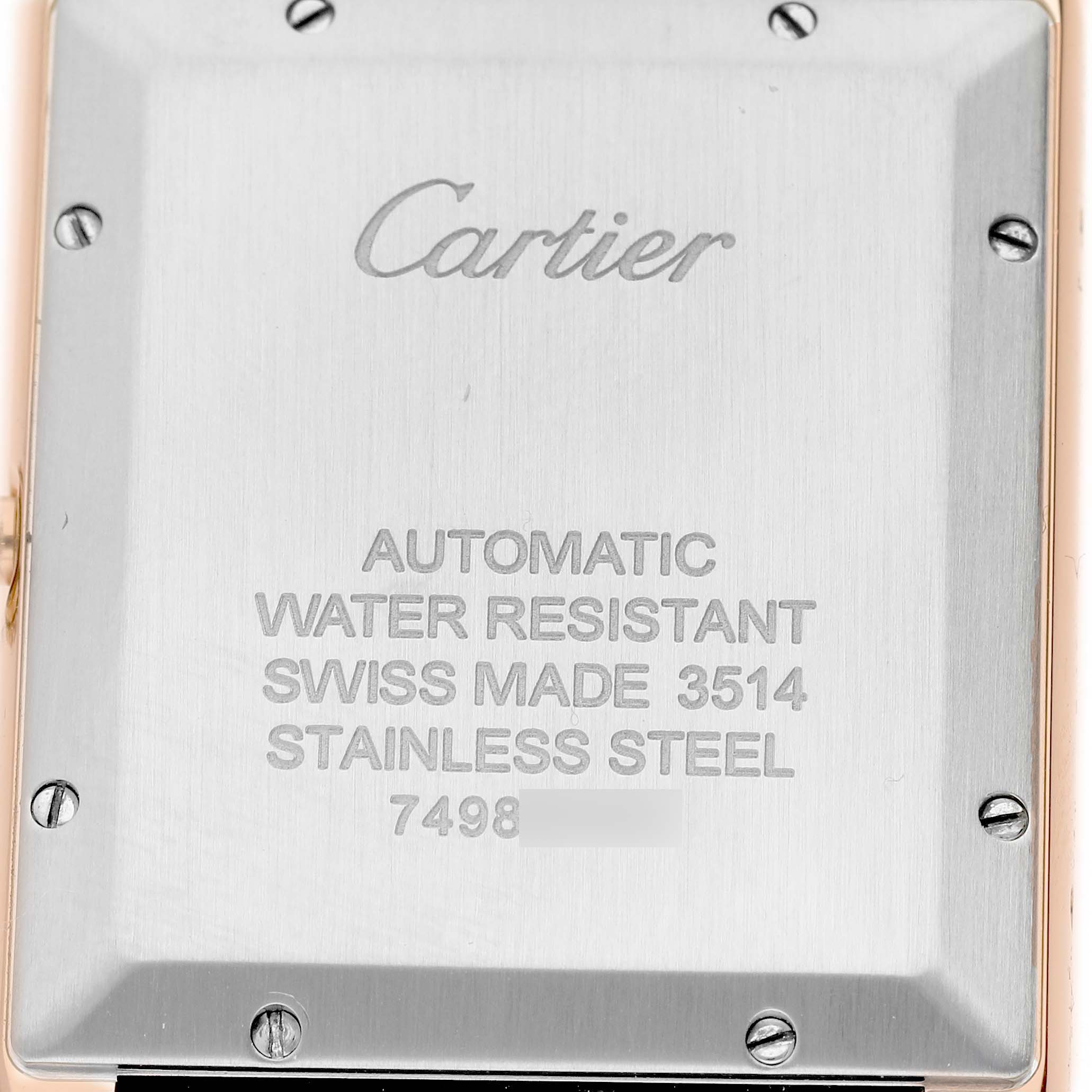 The image shows the back case of a Cartier Tank Solo W5200026 Men's Rose Gold Silver Dial watch, displaying engravings about its features and model information.