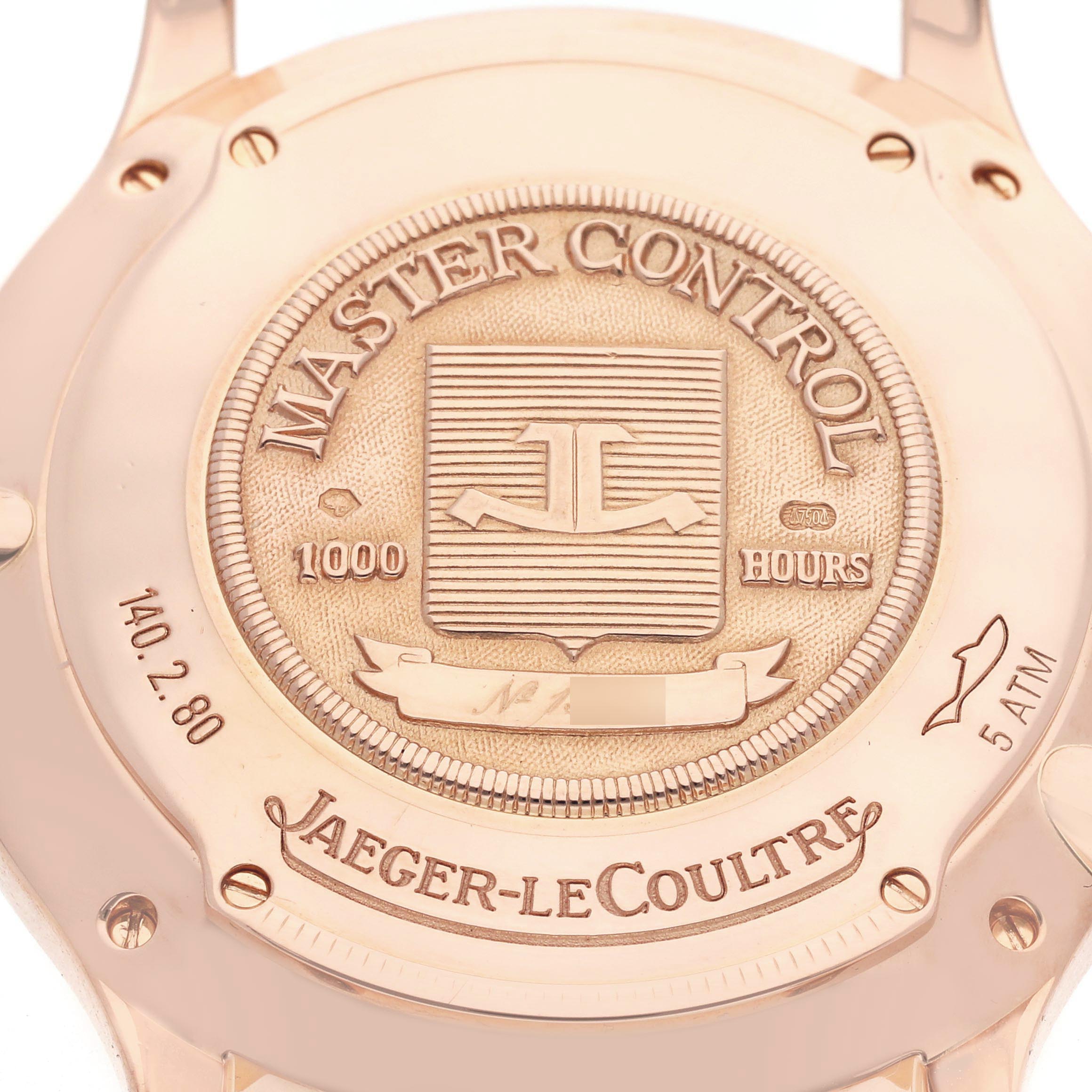 The image shows the case back of a Jaeger-LeCoultre Master Control watch, highlighting the embossed logo and text details.
