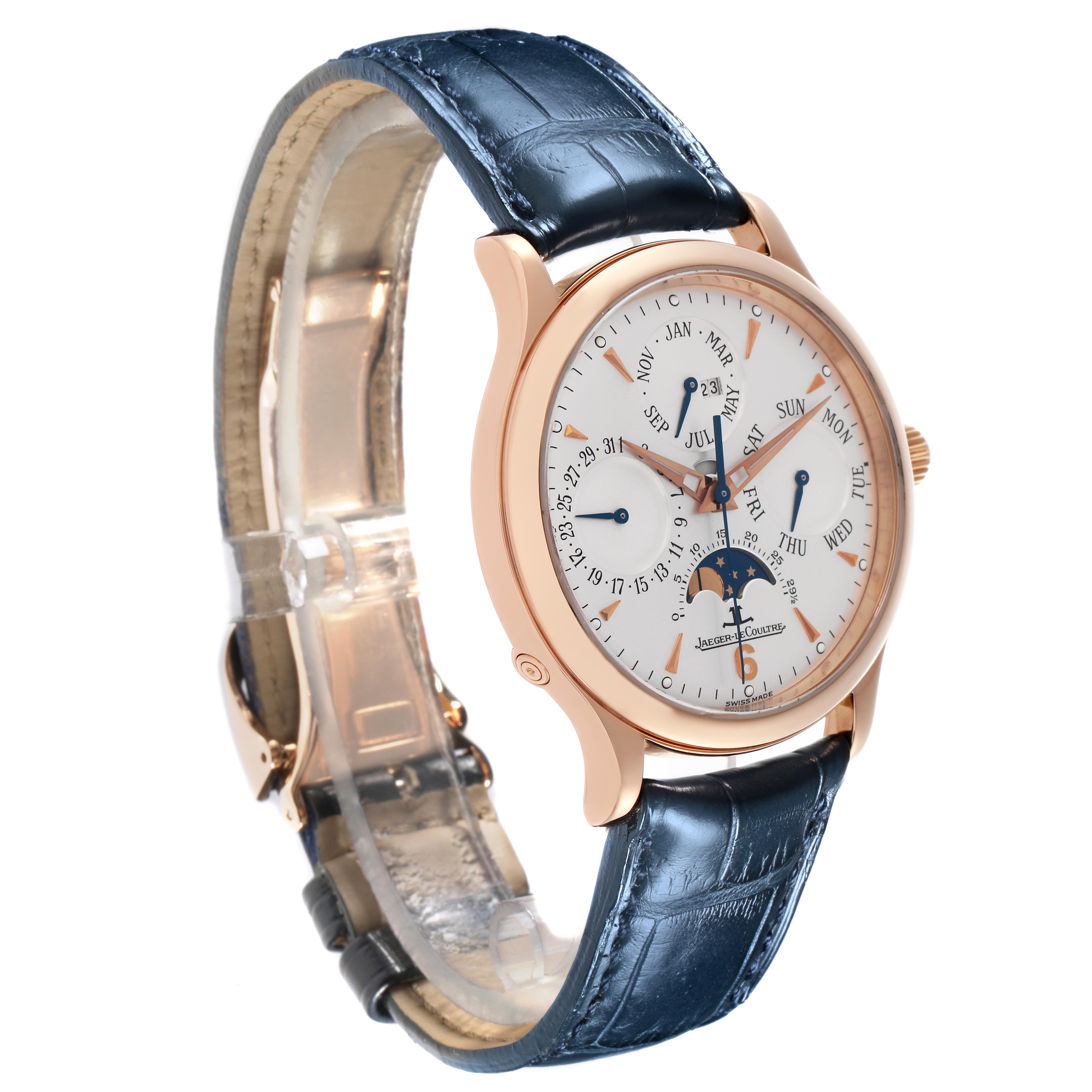 The Jaeger LeCoultre Master Q149242A Men
s Rose Gold Silver Dial Q149242A Men
s Rose Gold Silver Dial watch is shown at an angled side view, highlighting the dial, case, and blue leather strap.