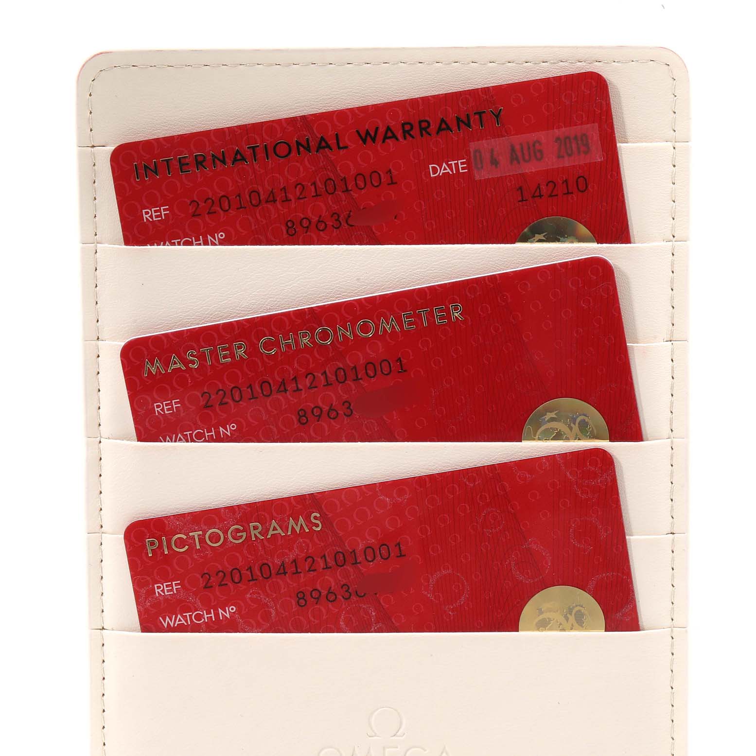 The image shows warranty, chronometer, and pictogram cards for an Omega Aqua Terra 220.10.41.21.01.001 Men's Stainless Steel Black Dial 220.10.41.21.01.001 Men's Stainless Steel Black Dial watch.