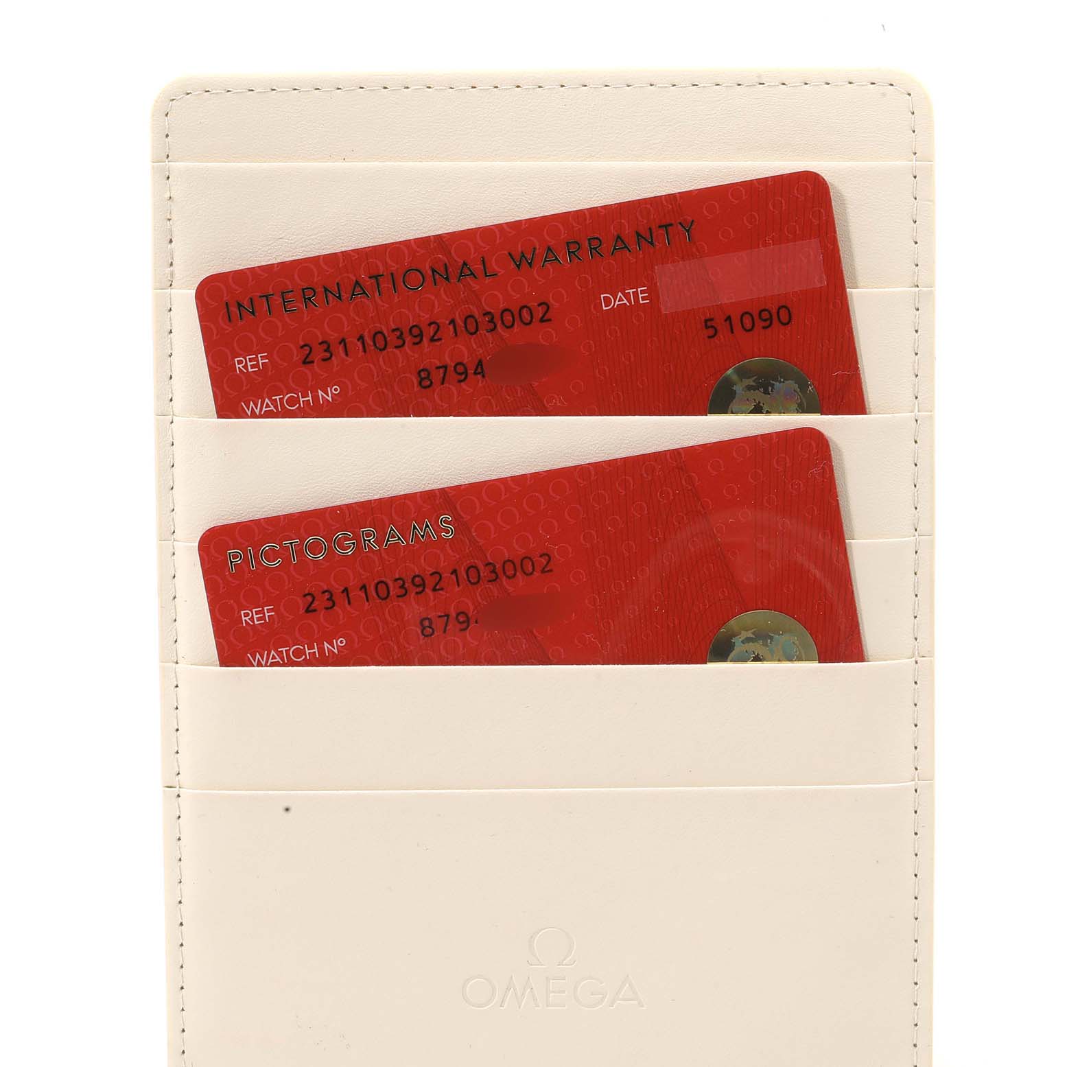 The image shows the international warranty and pictogram cards for the Omega Aqua Terra 231.10.39.21.03.002 Men
s Stainless Steel Blue Dial 231.10.39.21.03.002 Men
s Stainless Steel Blue Dial model, placed in a cream cardholder.