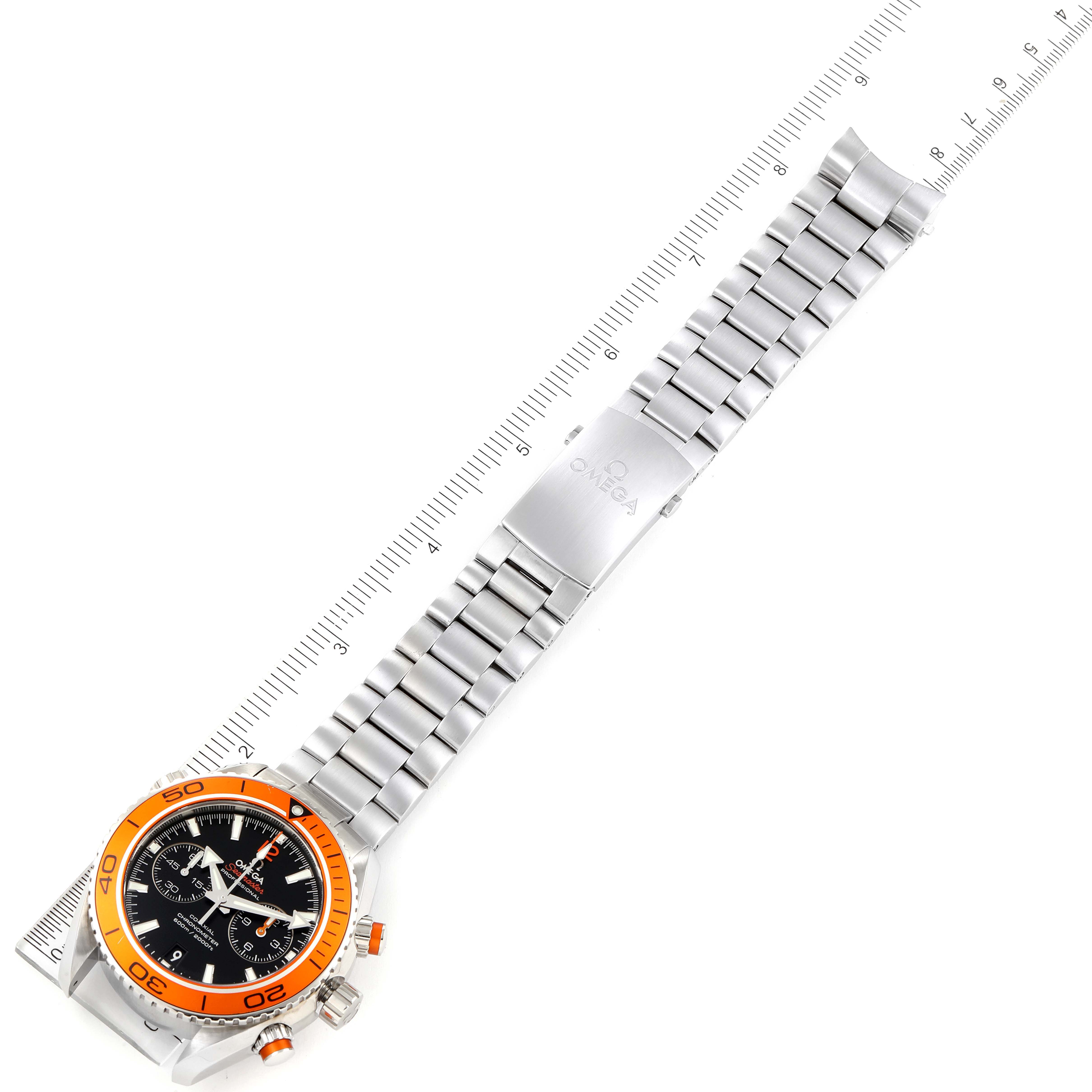 The image shows an Omega Planet Ocean 232.30.46.51.01.002 Men's Stainless Steel Black Dial 232.30.46.51.01.002 Men's Stainless Steel Black Dial watch at a top-down angle, highlighting the entire bracelet and the orange bezel.