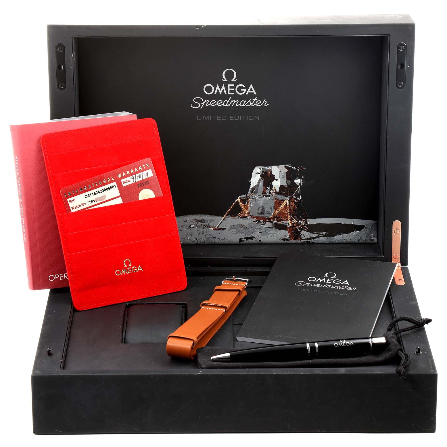 The image shows Omega Speedmaster 311.62.42.30.06.001 Men's Titanium Grey Dial 311.62.42.30.06.001 Men's Titanium Grey Dial accessories including a warranty card, strap, pen, and manuals, all in a presentation box.