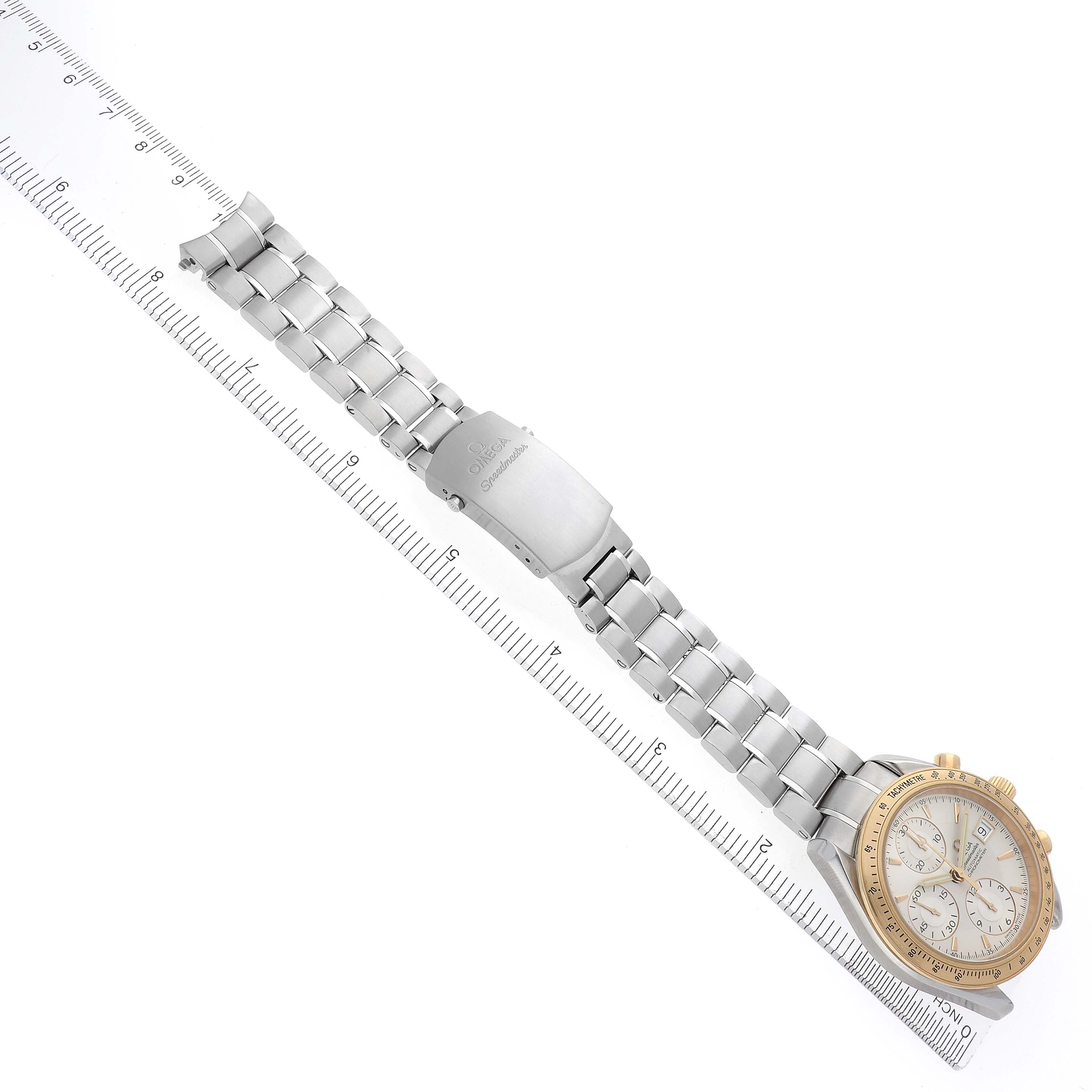 The Omega Speedmaster 323.21.40.40.02.001 Men
s Steel and Gold (two tone) Silver Dial 323.21.40.40.02.001 Men
s Steel and Gold (two tone) Silver Dial watch is shown at a diagonal angle, displaying its full bracelet, clasp, and watch face.