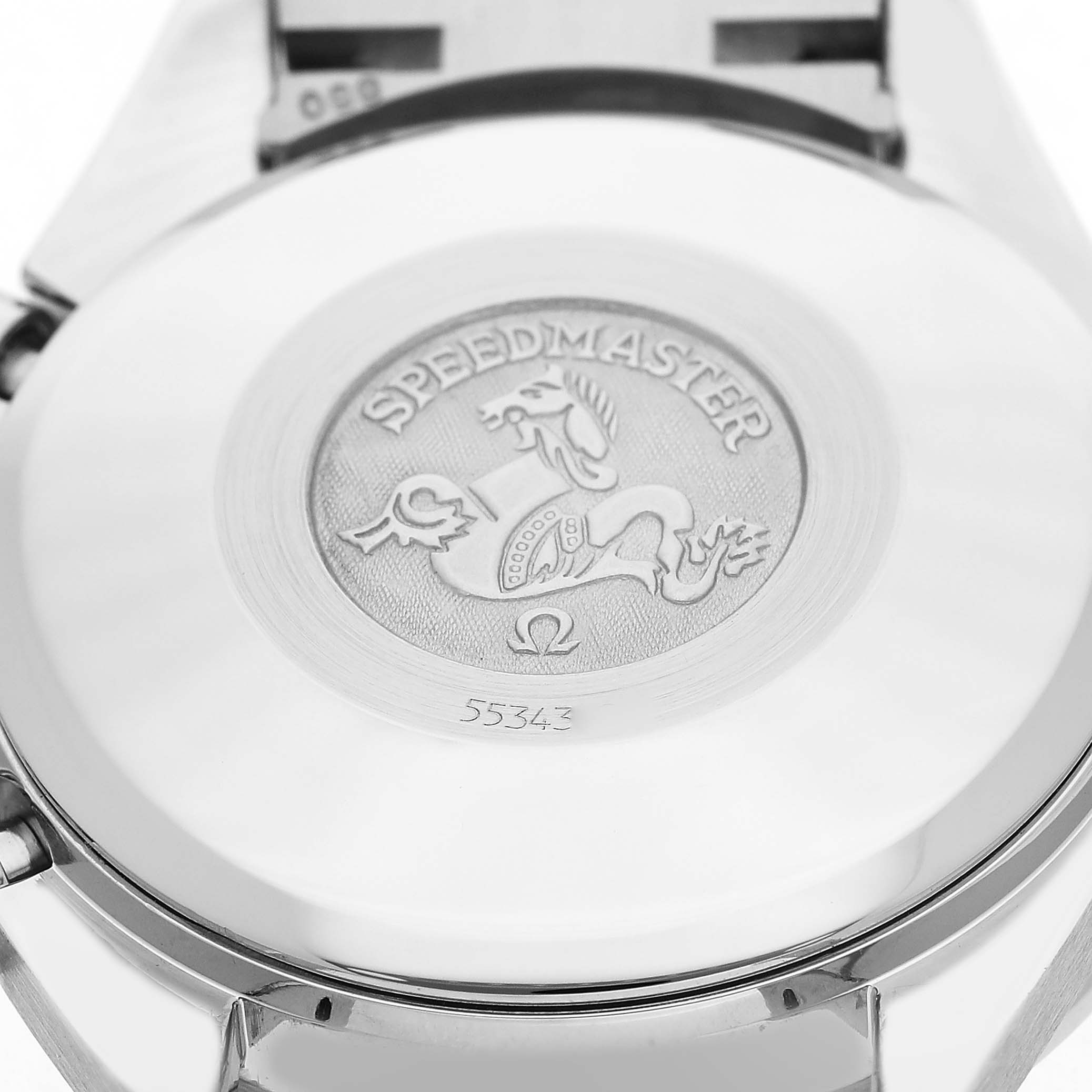 The image shows the back case of an Omega Speedmaster 3813.53.26 Men's Stainless Steel Black Dial watch with its engraved logo and serial number.