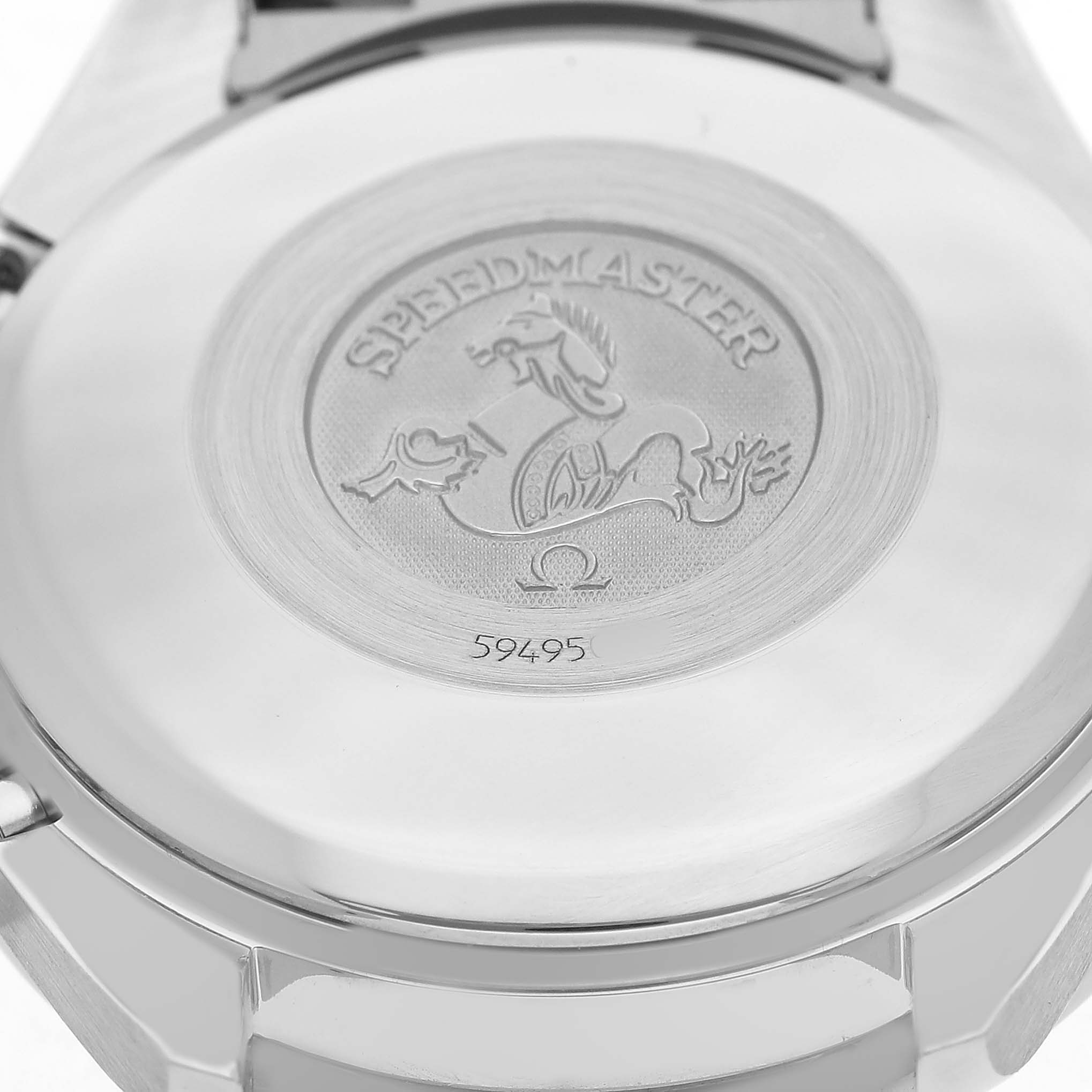 The image shows the back case of an Omega Speedmaster 3523.30.00 Men's Stainless Steel Silver Dial watch, featuring branding and engravings.