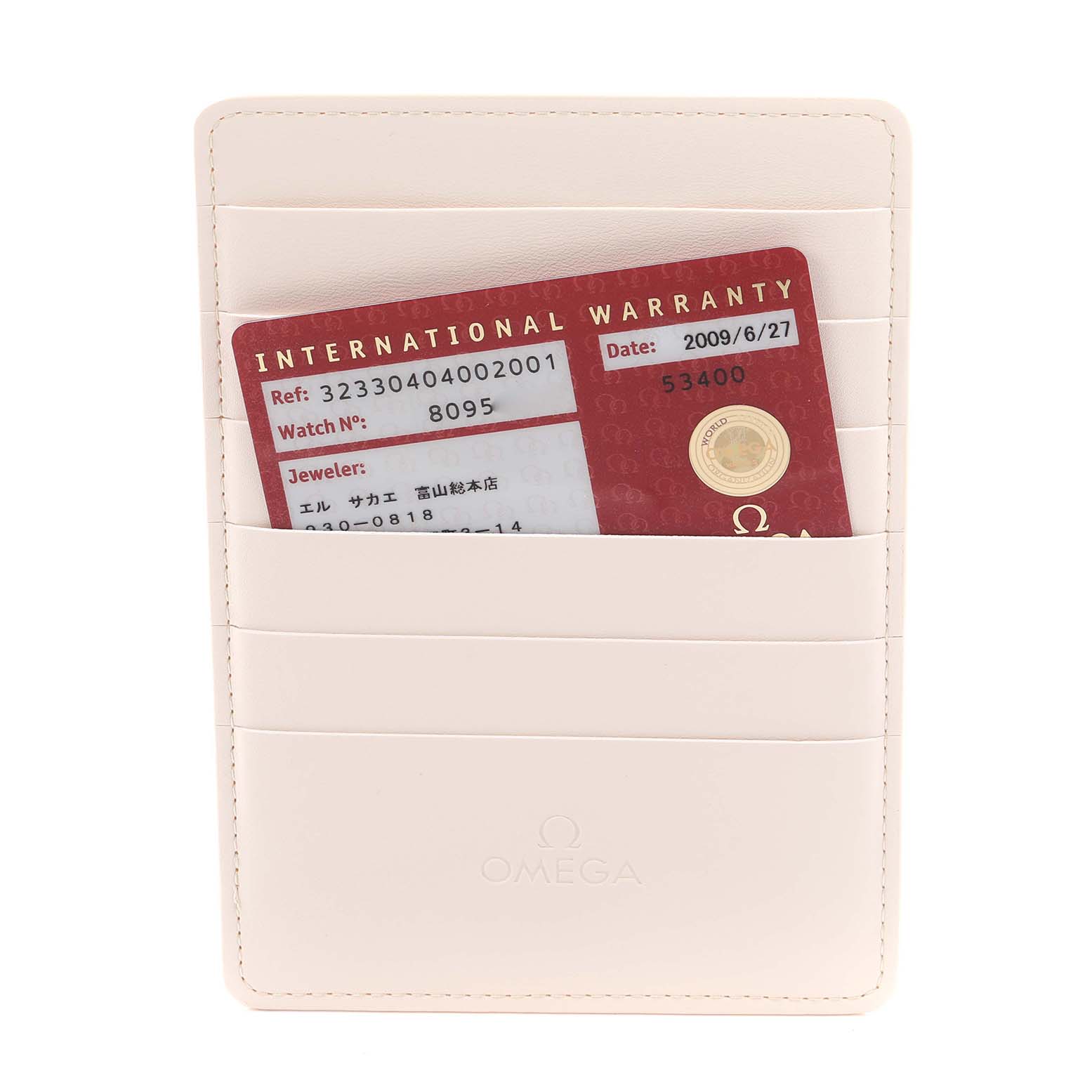 The image shows an Omega Speedmaster 323.30.40.40.02.001 Men
s Stainless Steel White Dial 323.30.40.40.02.001 Men
s Stainless Steel White Dial warranty card in a cream-colored holder, viewed from the front.