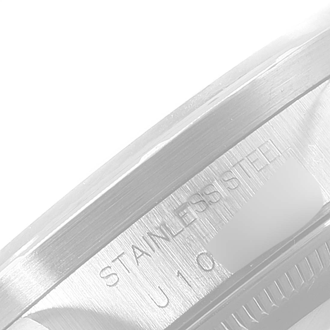 This close-up image shows the engraved text "STAINLESS STEEL" on the side of the Rolex Air-King 14010 Men's Stainless Steel Pink Dial 14010 Men's Stainless Steel Pink Dial watch's casing.