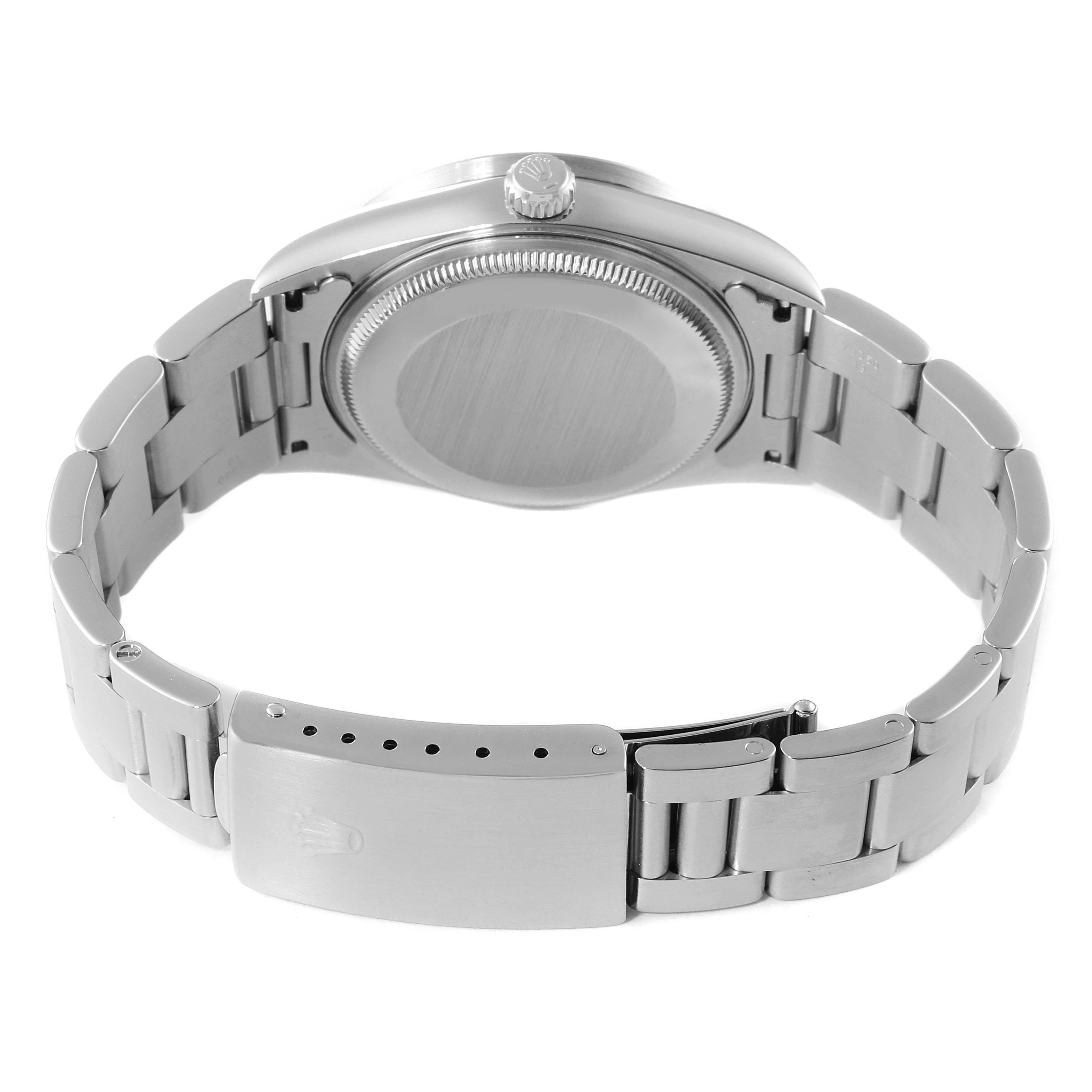 This image shows the back and clasp of the Rolex Air-King 14010 Men's Stainless Steel Pink Dial 14010 Men's Stainless Steel Pink Dial watch, highlighting its stainless steel bracelet and closed caseback.