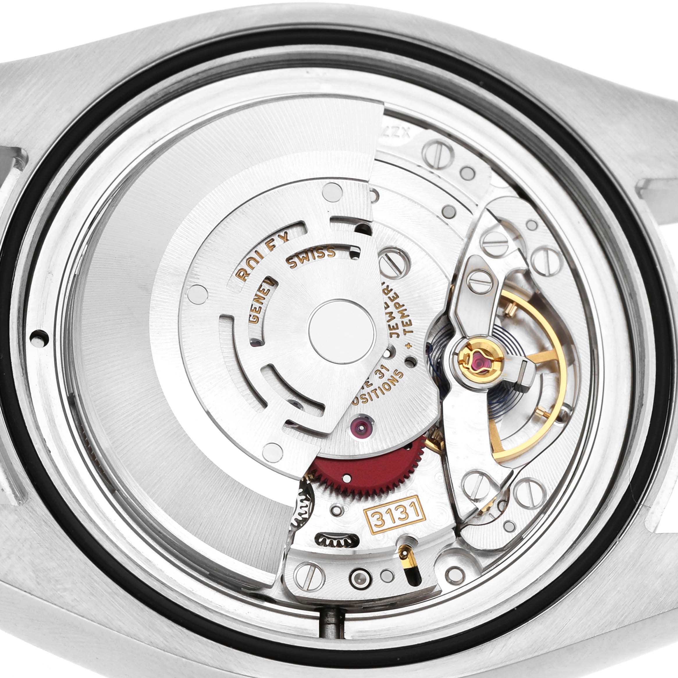 The image shows the movement of a Rolex Air-King 116900 Men's Stainless Steel Black Dial watch from a top-down angle, highlighting its intricate inner mechanisms.