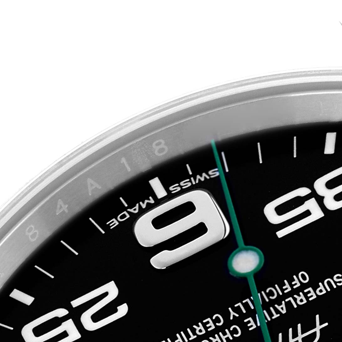 This image shows a close-up of the Rolex Air-King 116900 Men's Stainless Steel Black Dial 116900 Men's Stainless Steel Black Dial watch's dial, highlighting the "9" numeral and part of the minute hand.