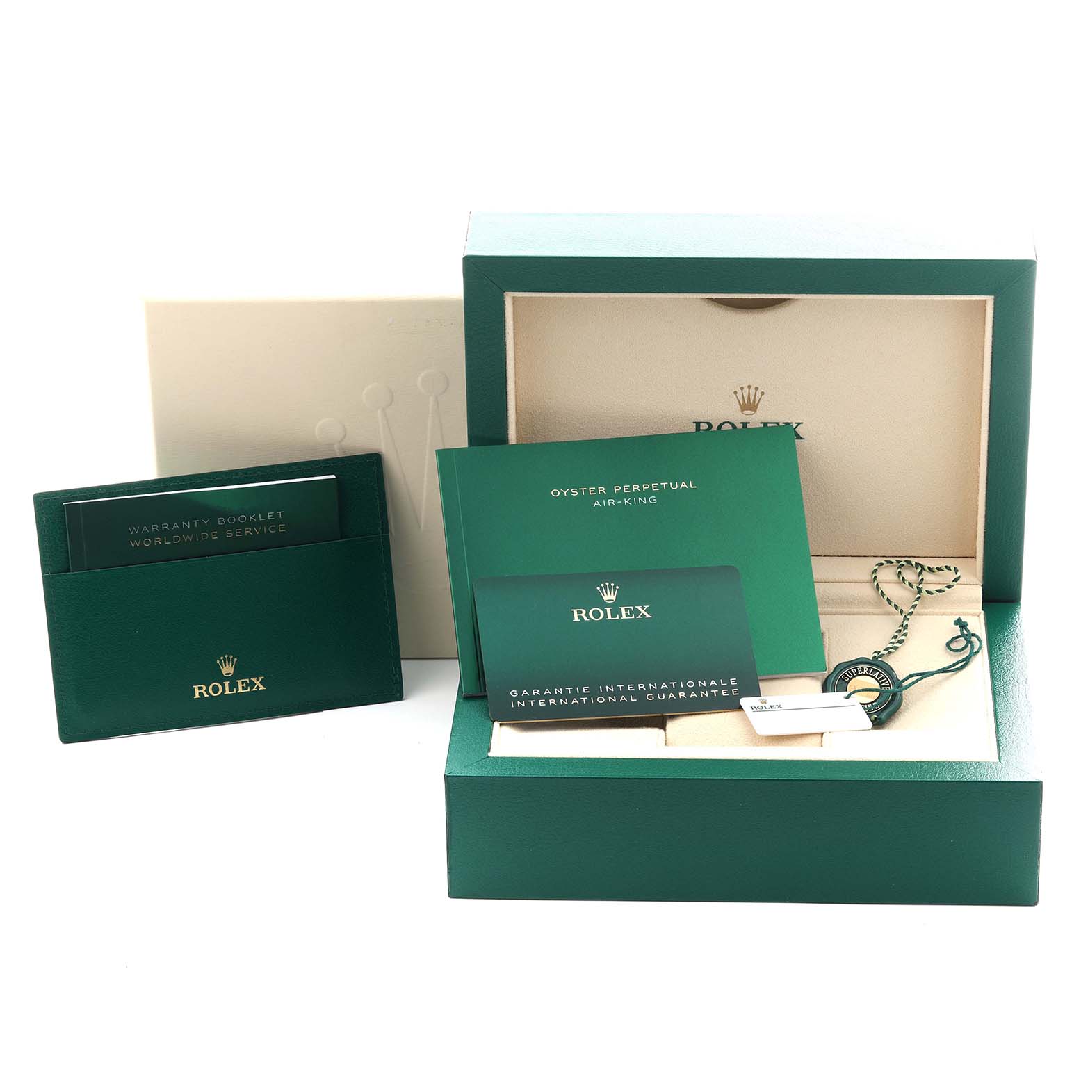 The image shows the packaging and accessories for a Rolex Air-King 116900 Men's Stainless Steel Black Dial 116900 Men's Stainless Steel Black Dial watch, including boxes, booklets, and a tag.
