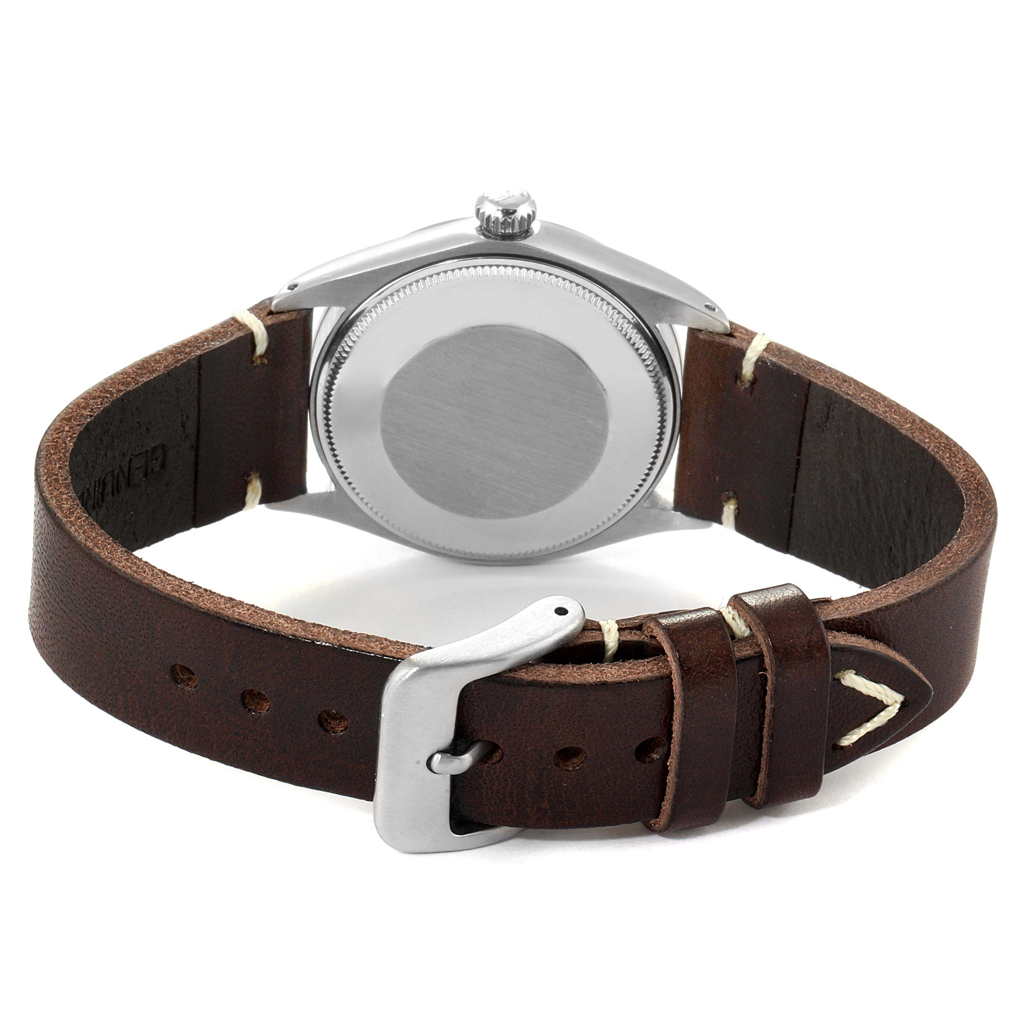 The image shows the back case and leather strap with buckle of the Vintage Collection model by Rolex from a rear angle.