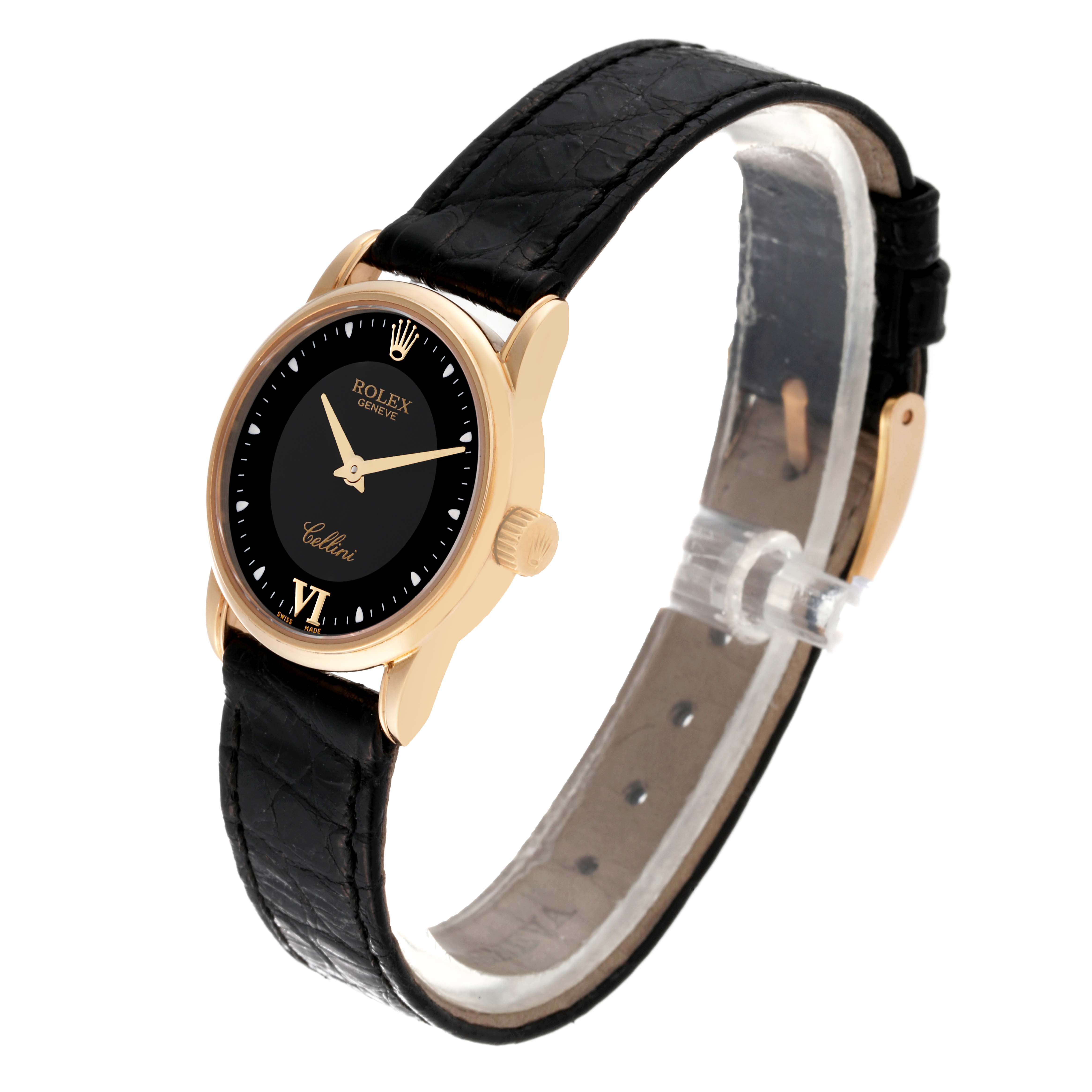 The Rolex Cellini 6111/8 Women
s Yellow Gold Black Dial 6111/8 Women
s Yellow Gold Black Dial watch is shown at a three-quarter angle, highlighting its black dial, gold case, and black leather strap.