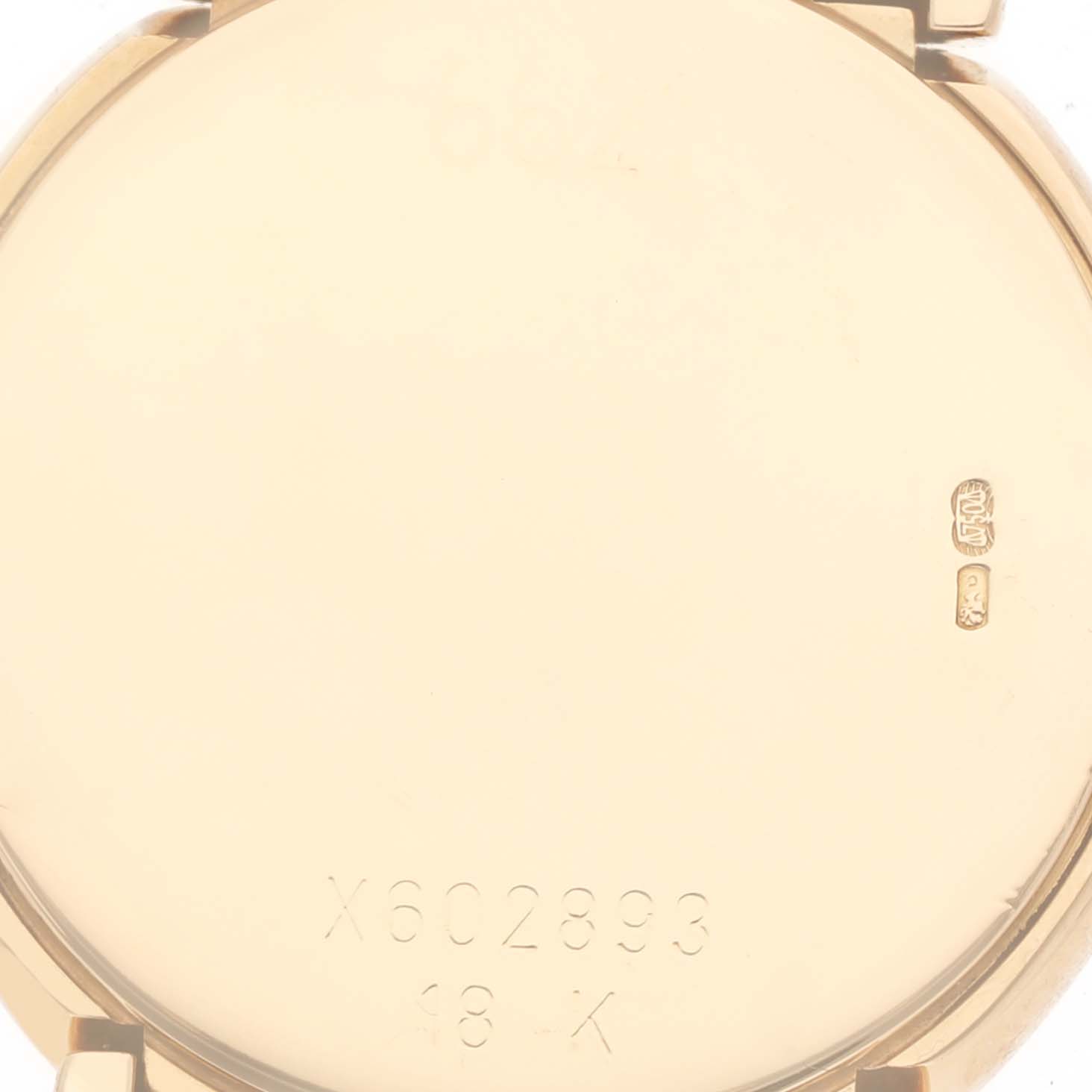 The image shows the back case of a Rolex Cellini 6621/8 Women's Yellow Gold Champagne Dial 6621/8 Women's Yellow Gold Champagne Dial watch, highlighting the serial number and 18K gold markings.