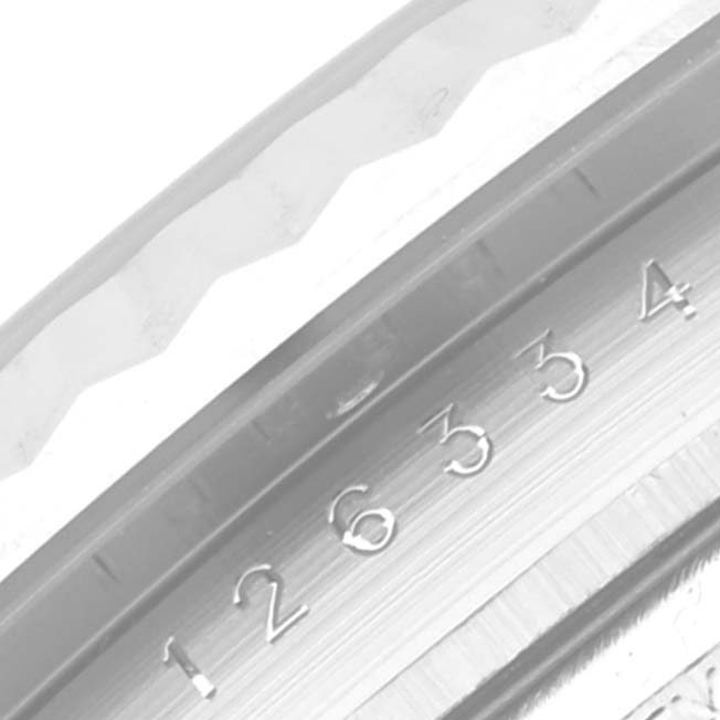 The image shows a close-up of the bezel and part of the dial of the Rolex Datejust 41 126334 Men
s Stainless Steel Blue Dial 126334 Men
s Stainless Steel Blue Dial model watch.