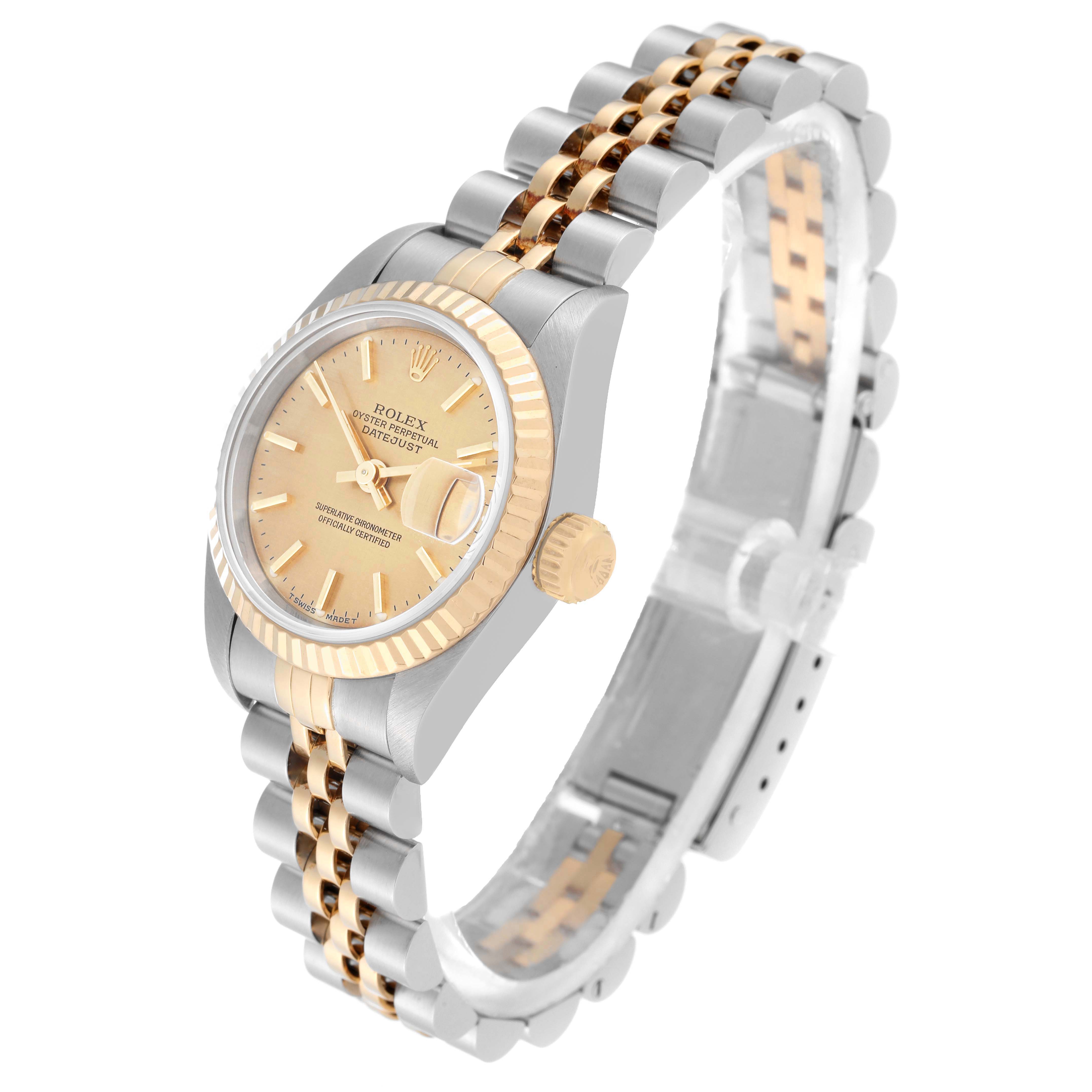 The Rolex Datejust 69173 Women's Steel and Gold (two tone) Champagne Dial 69173 Women's Steel and Gold (two tone) Champagne Dial watch is shown at an angled view, showcasing its dial, fluted bezel, and two-tone bracelet.