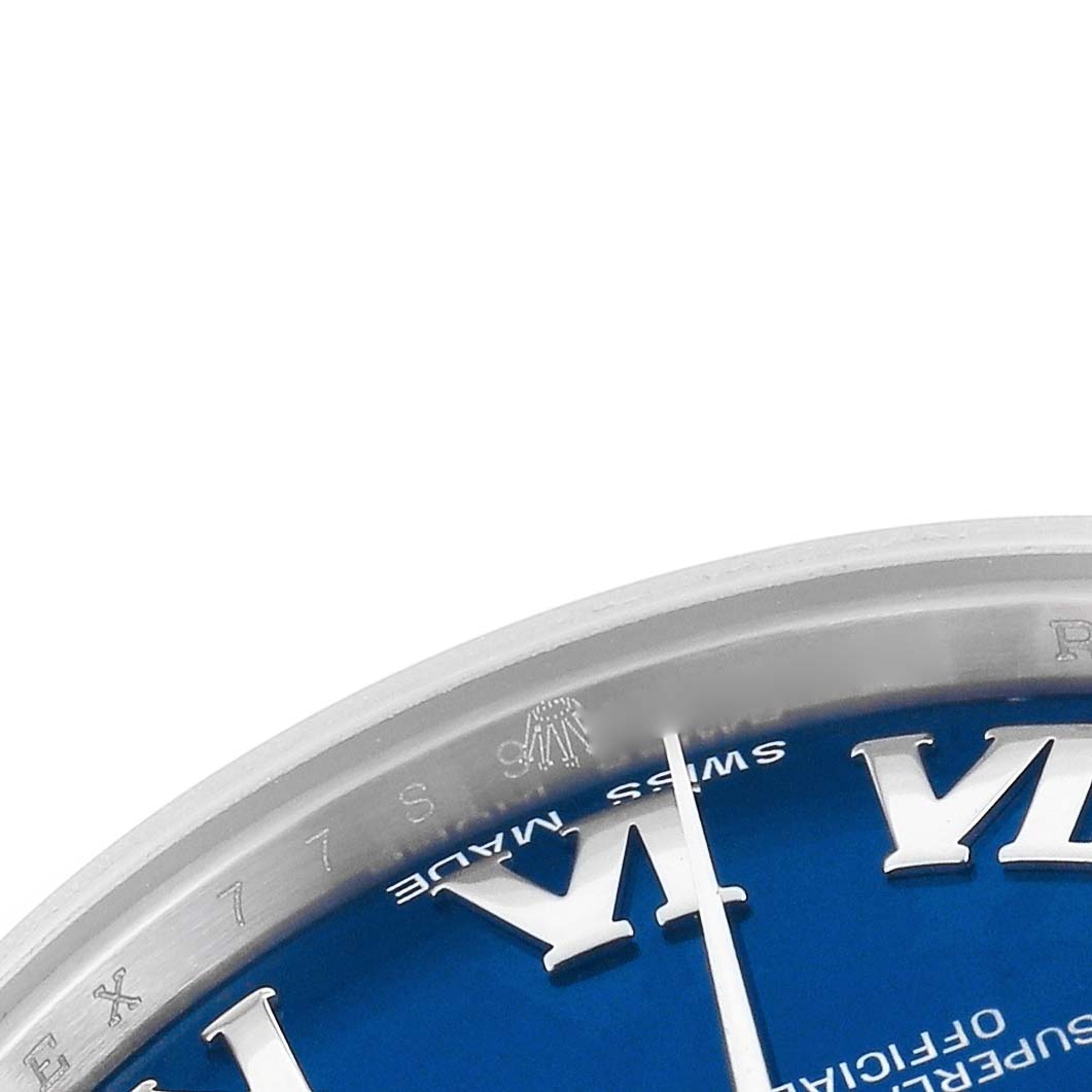 The image shows a close-up of the Rolex Mid-Size 178240 Women
s Stainless Steel Blue Dial 178240 Women
s Stainless Steel Blue Dial watch face featuring the edge of the blue dial with part of the VI numeral and the "Swiss Made" text.