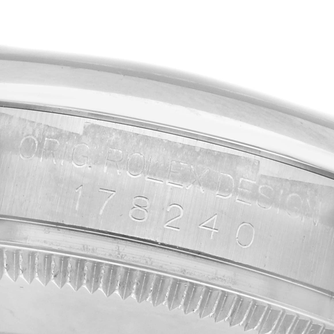 The image shows a close-up of the side engraving and fluted bezel of a Rolex Mid-Size 178240 Women
s Stainless Steel Blue Dial 178240 Women
s Stainless Steel Blue Dial watch, model number 178240.